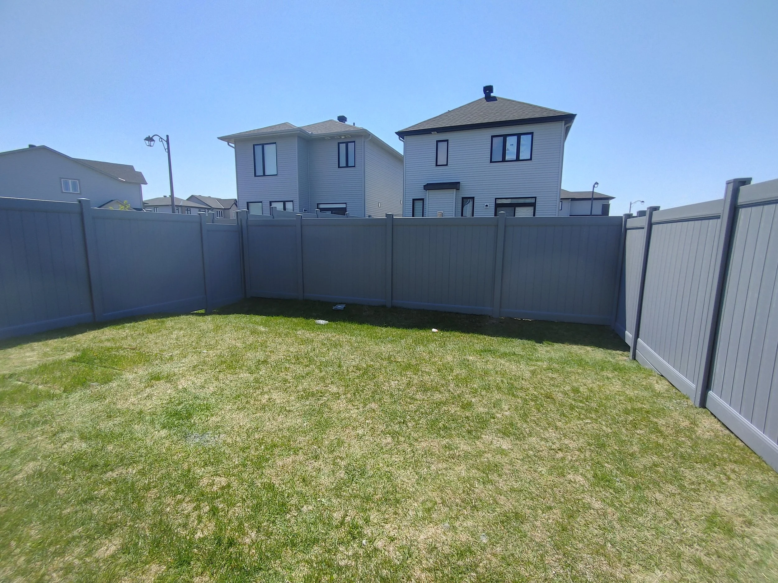 Grey PVC Fence in Barrhaven, 2025. StandArt Fence 