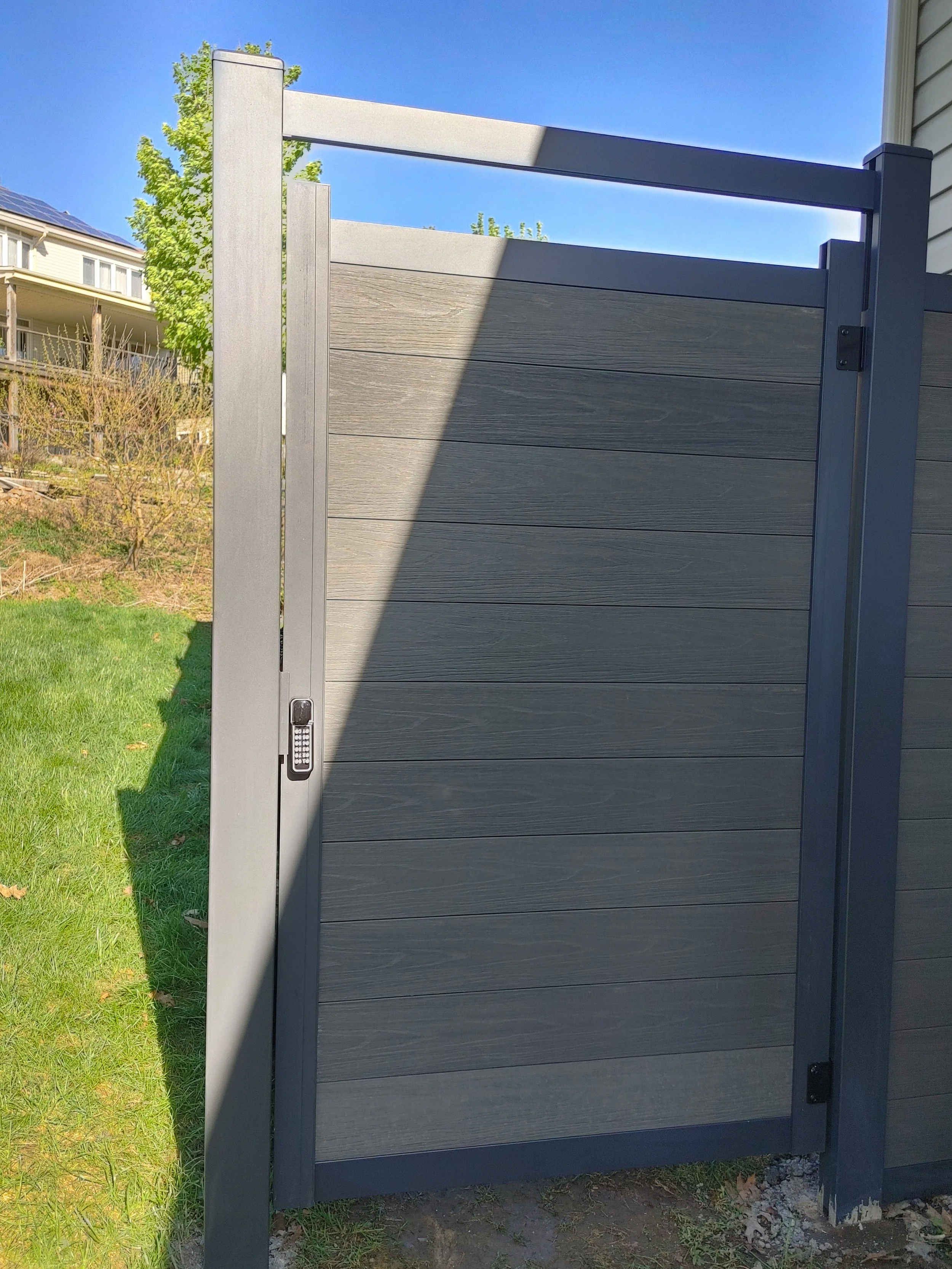 Dark Grey WPC and Iron Fence in Barrhaven, 2025. StandArt Fence 