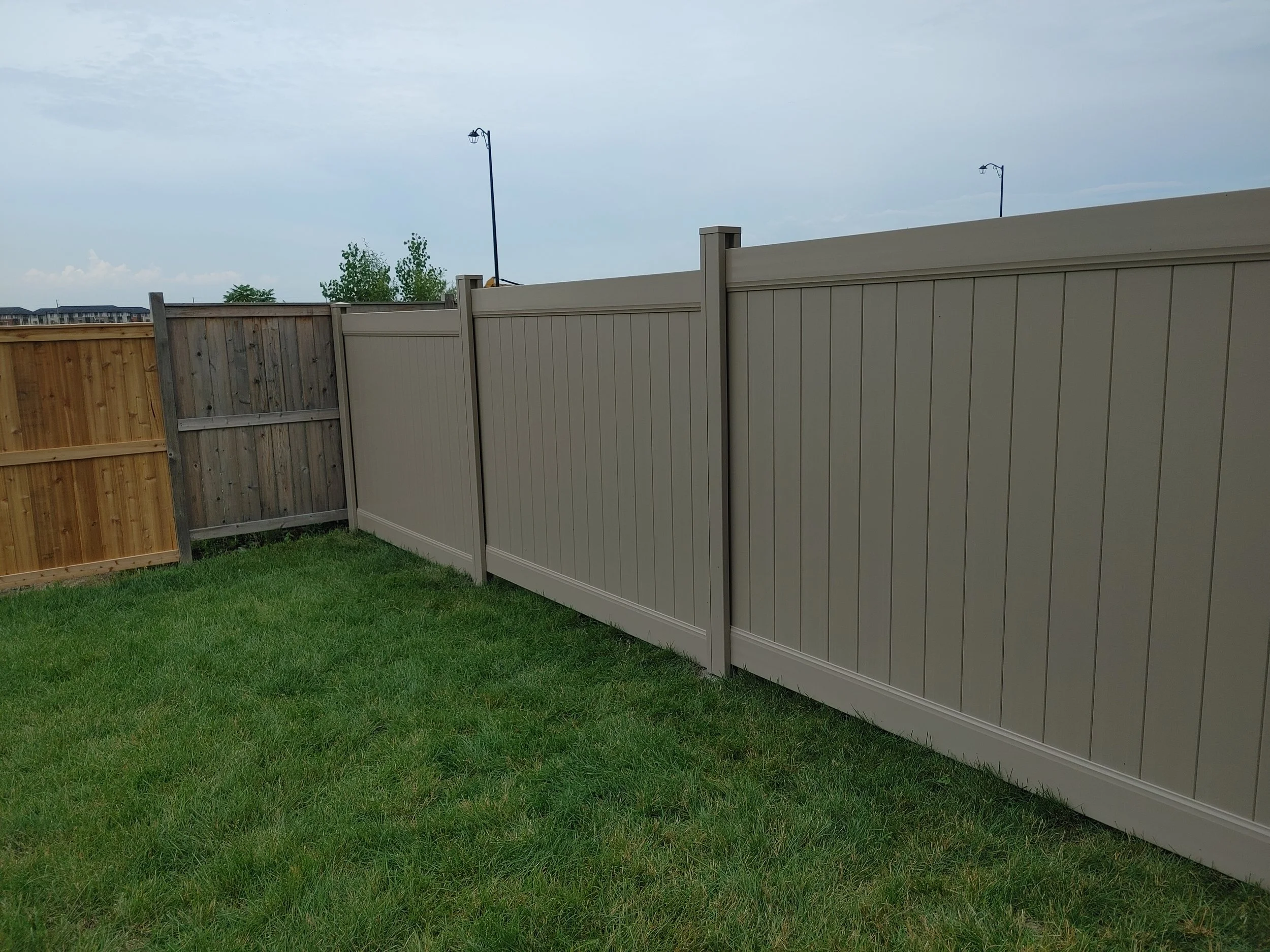 Adobe PVC Fence in Barrhaven, 2025. StandArt Fence 