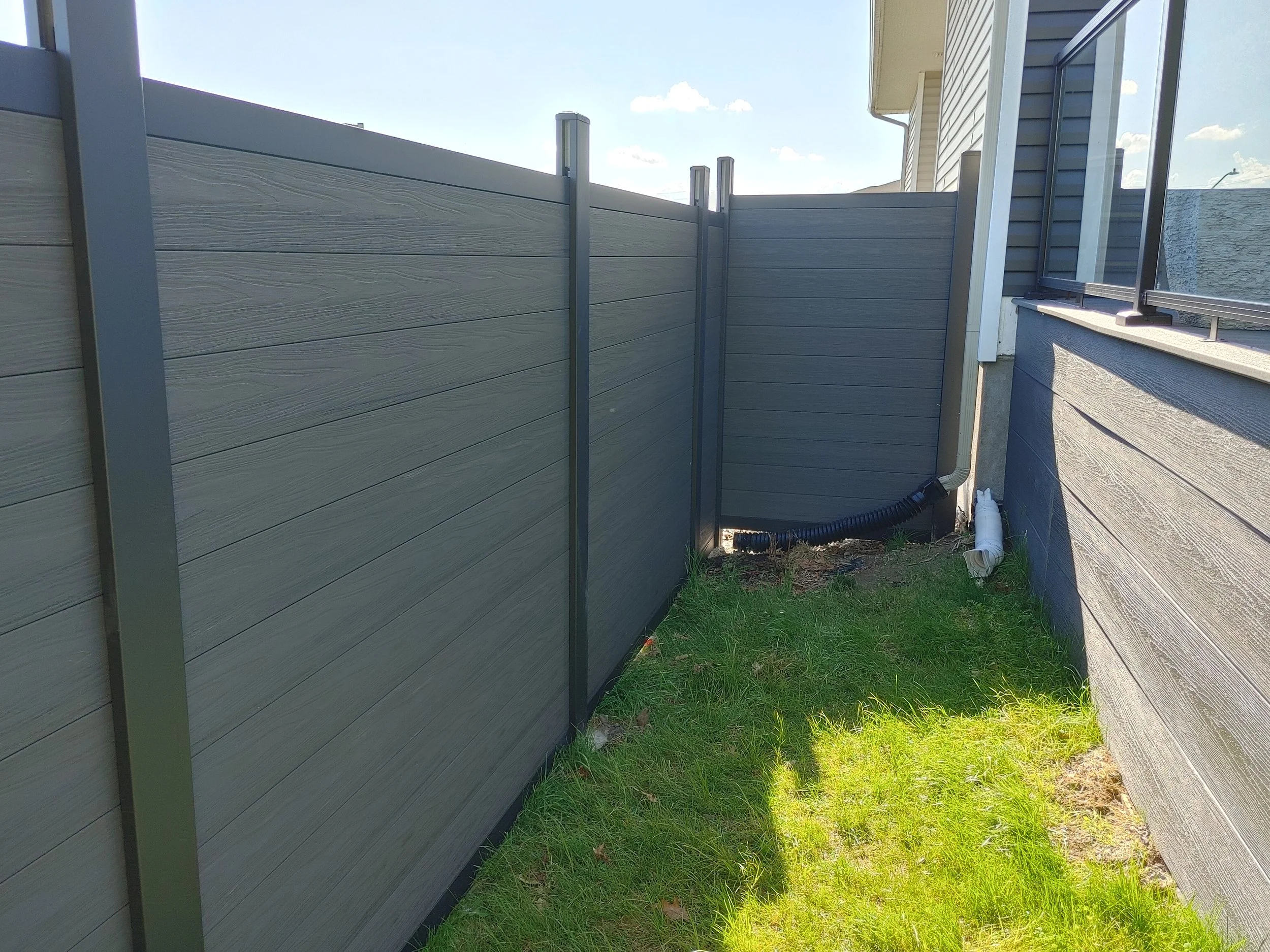 Dark Grey WPC and Iron Fence in Barrhaven, 2025. StandArt Fence 