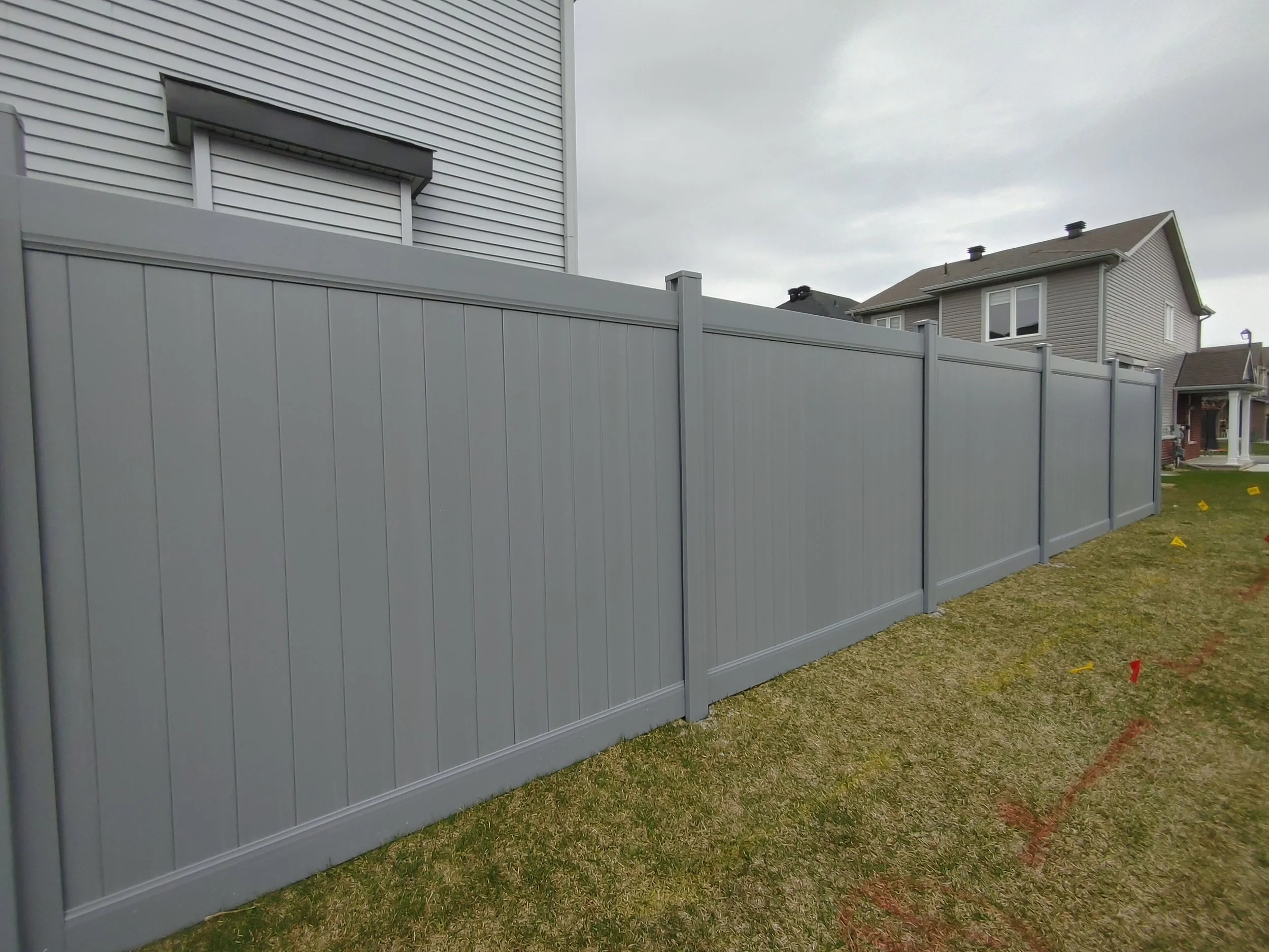 Grey PVC Fence in Barrhaven, 2025. StandArt Fence 