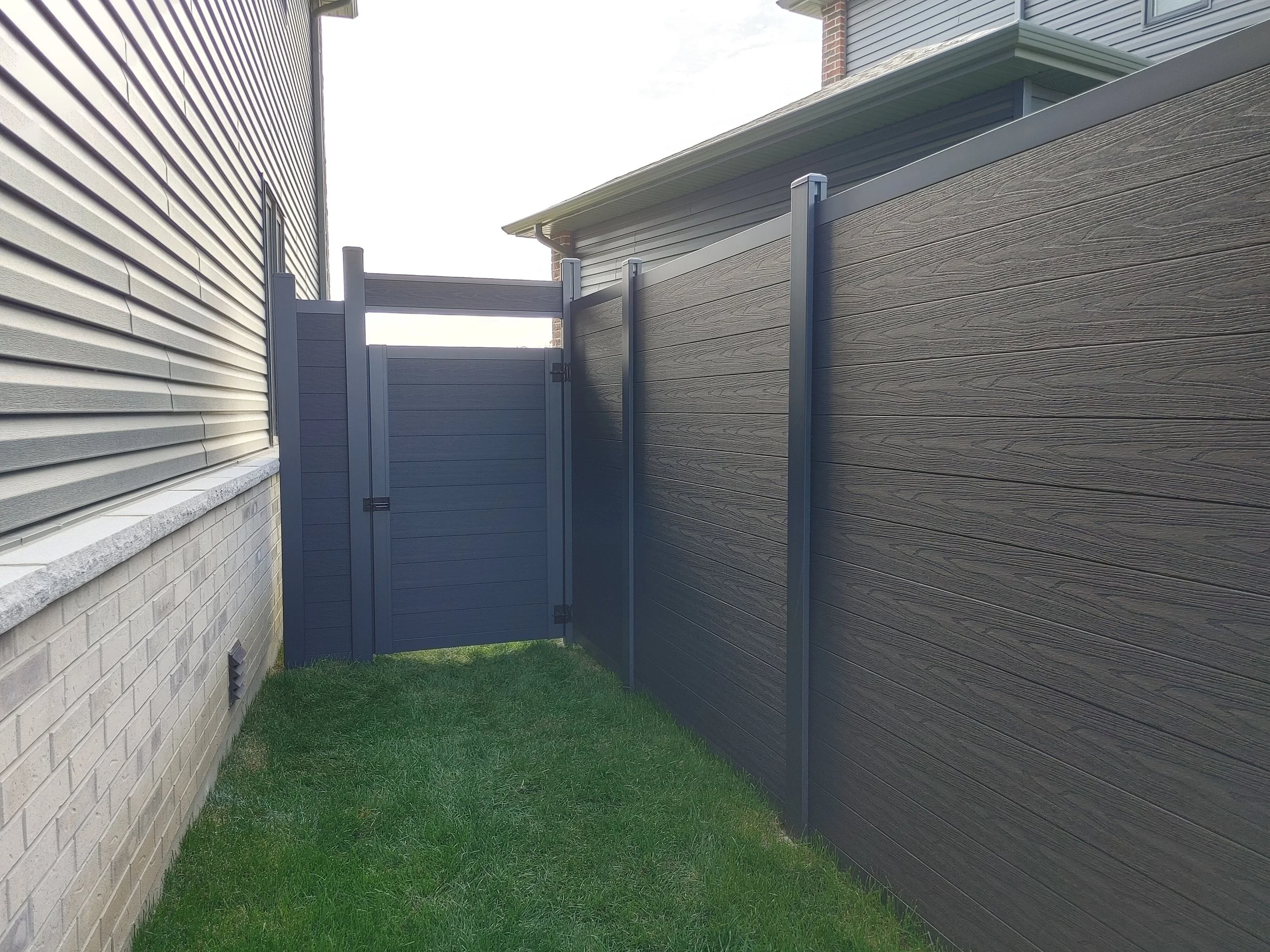 Black WPC Fence in Manotick, 2025. StandArt Fence