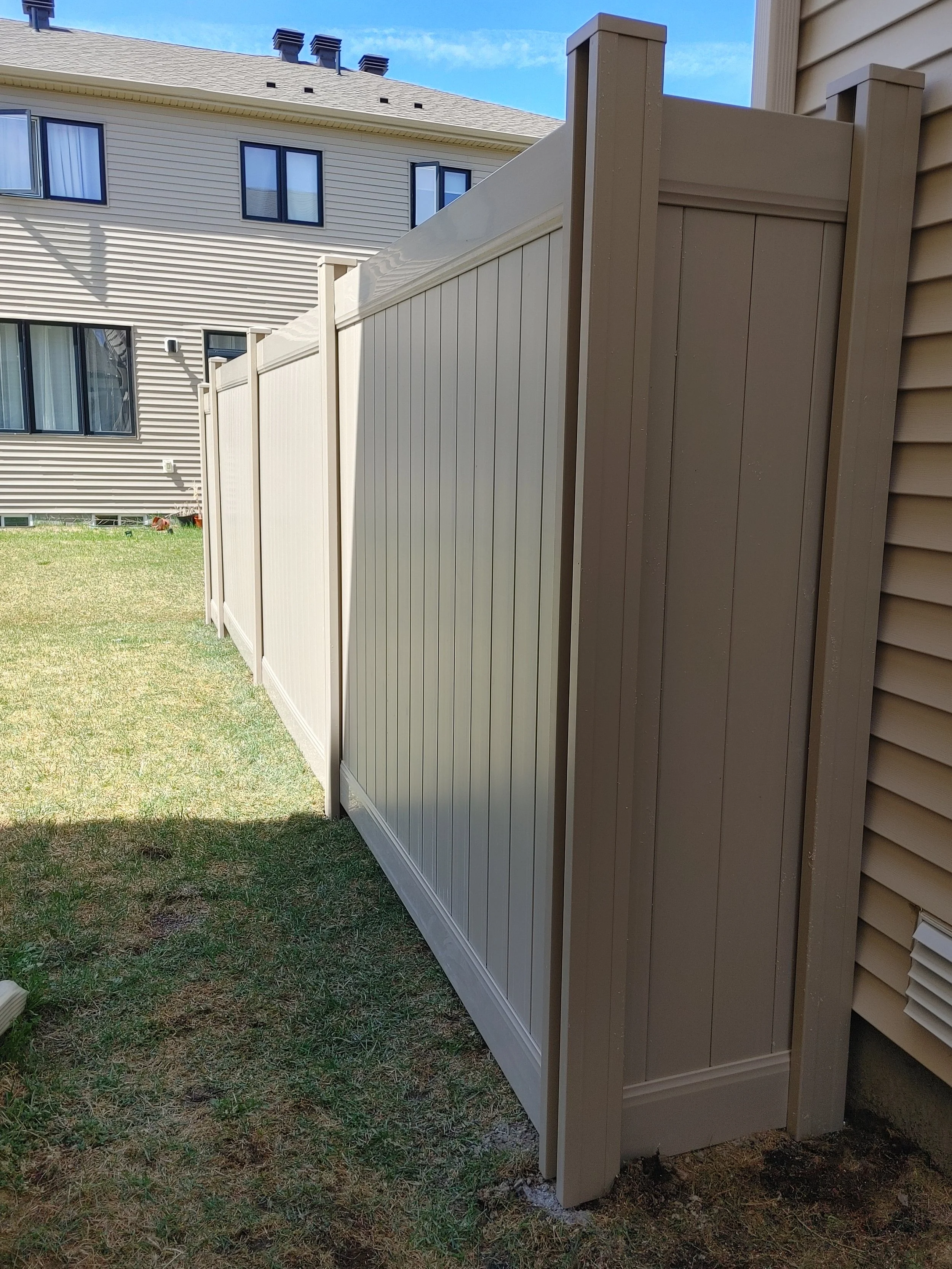 Grey PVC Fence in Barrhaven, 2025. StandArt Fence 