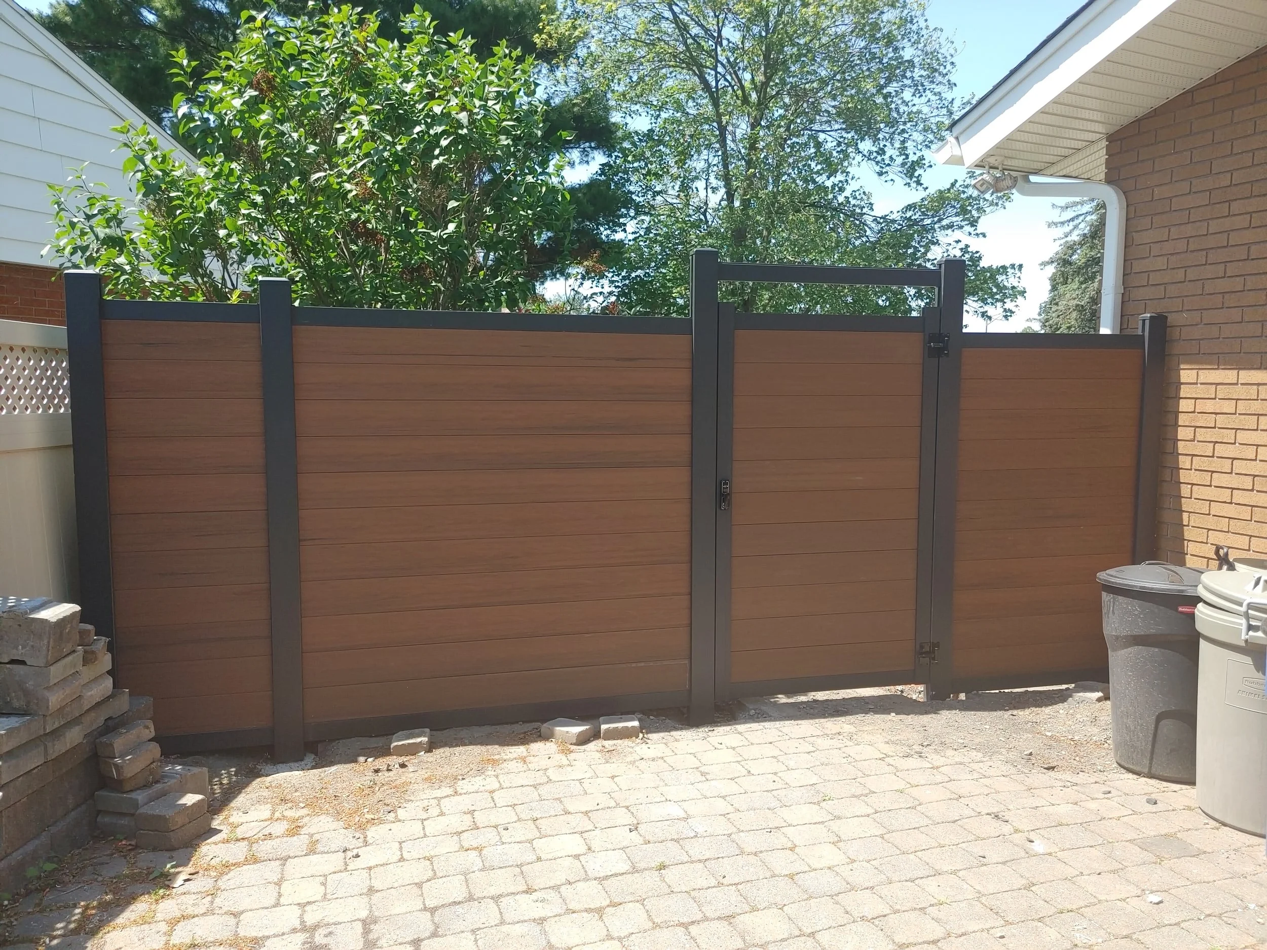 Brown WPC Fence in Vanier, 2025. StandArt Fence 