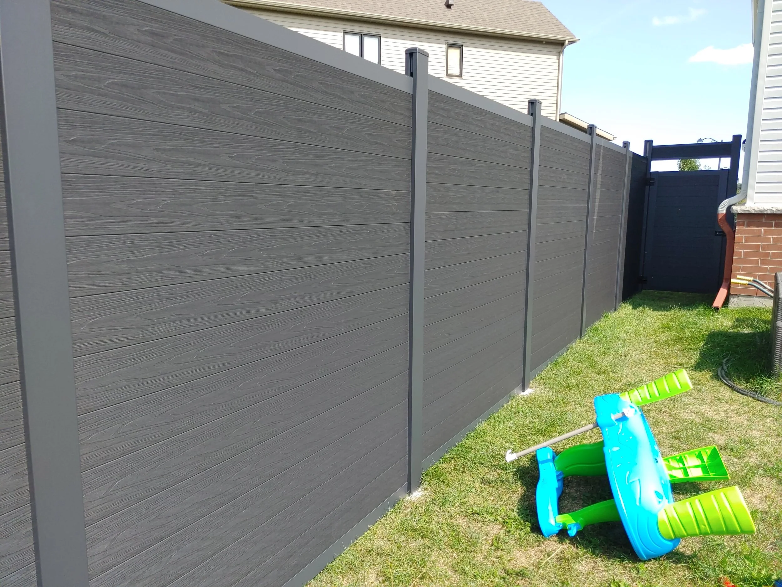 Black WPC Fence in Manotick, 2025. StandArt Fence