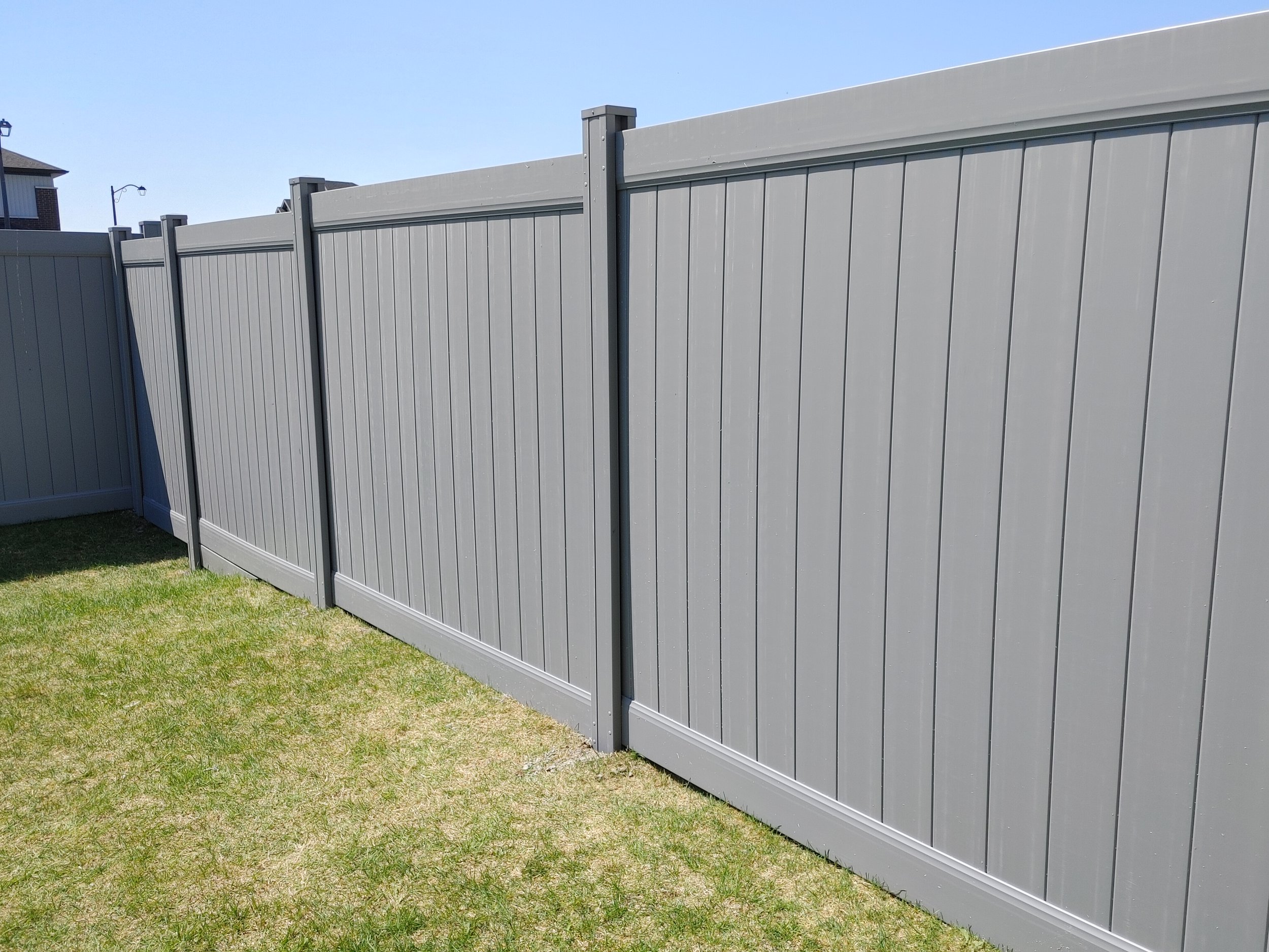 Grey PVC Fence in Barrhaven, 2025. StandArt Fence 