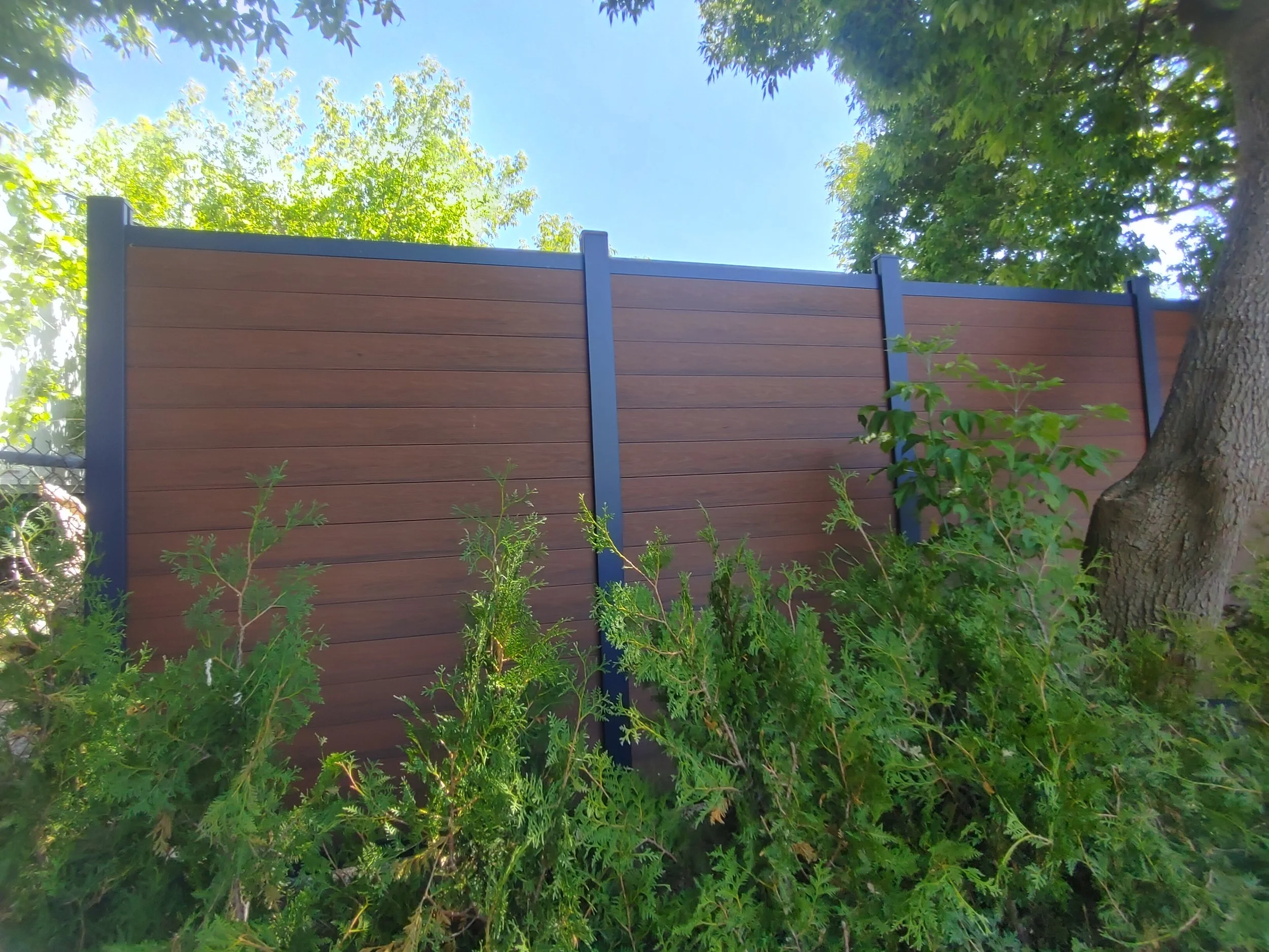 Brown WPC Fence in Vanier, 2025. StandArt Fence 