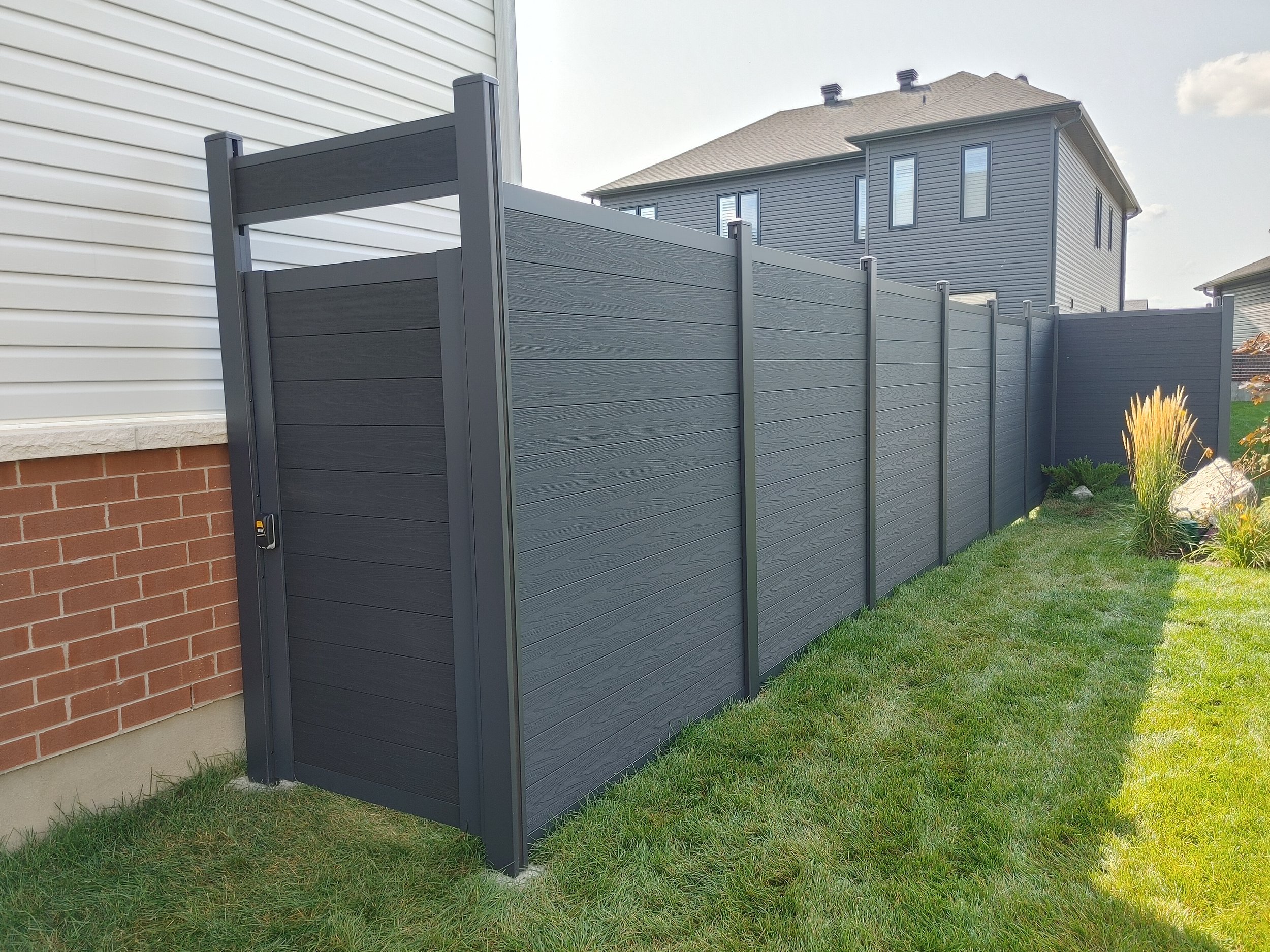 Black WPC Fence in Manotick, 2025. StandArt Fence