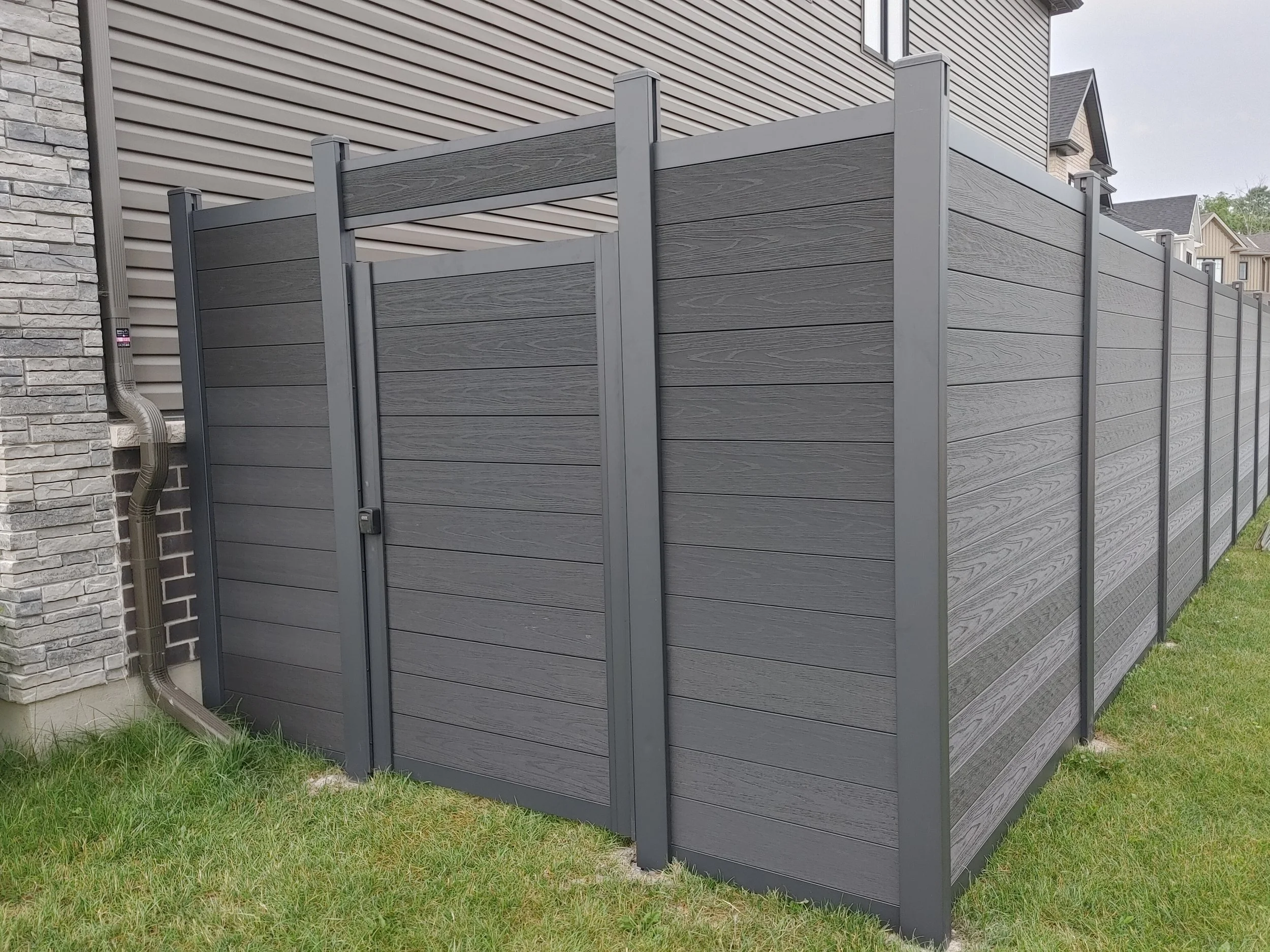 Black WPC Fence in Manotick, 2025. StandArt Fence 