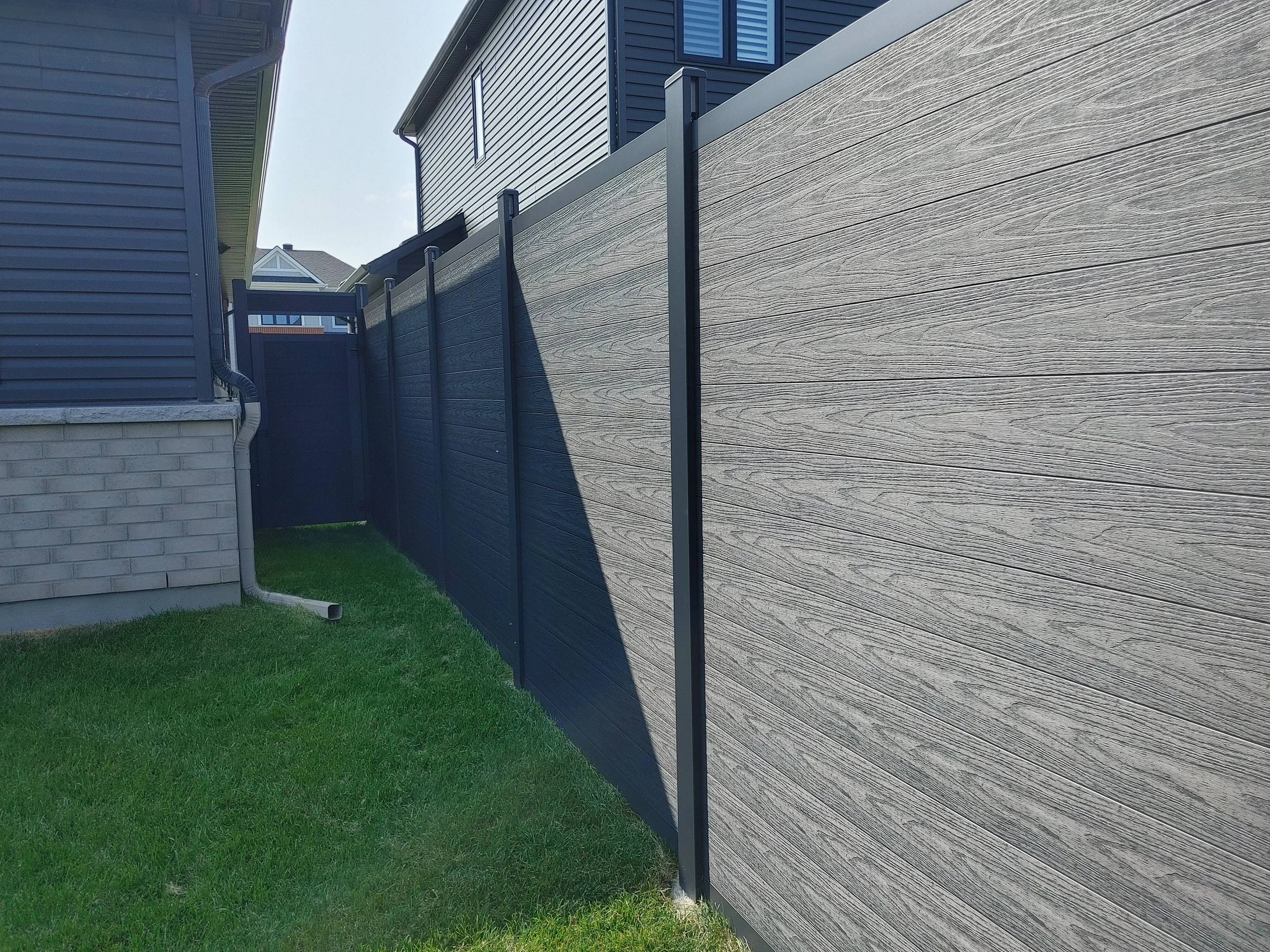 Black WPC Fence in Manotick, 2025. StandArt Fence