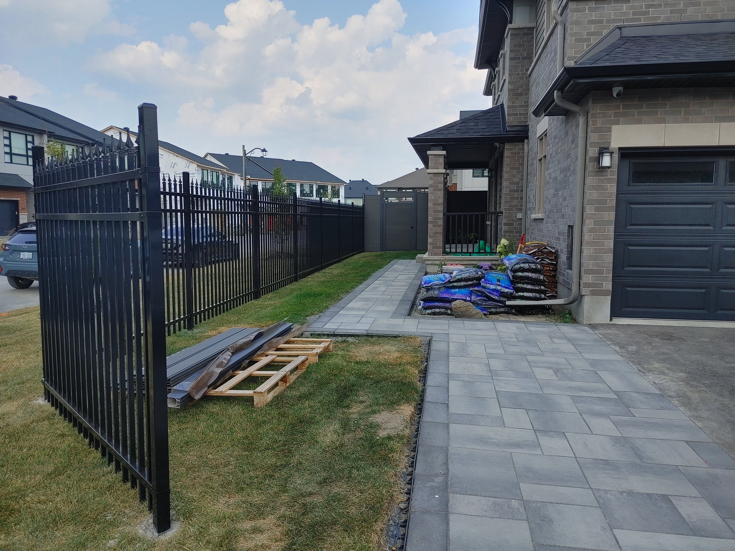 Dark Grey WPC/Iron Fence in Stittsville, 2025. StandArt Fence 