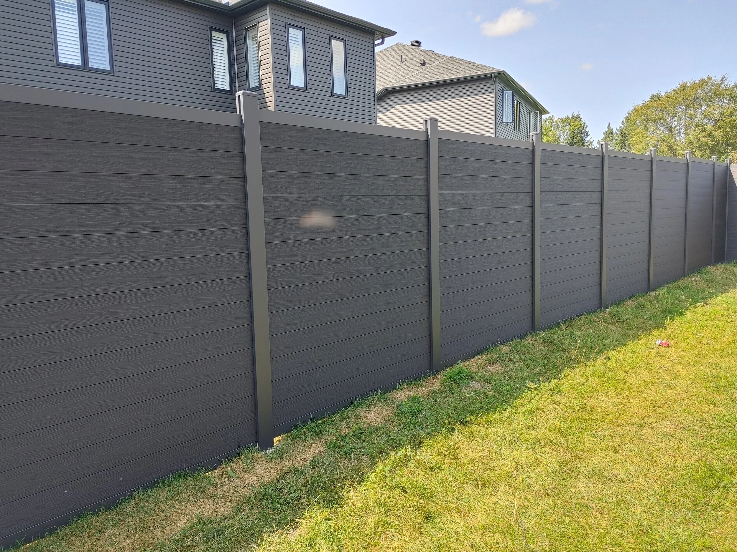 Black WPC Fence in Manotick, 2025. StandArt Fence
