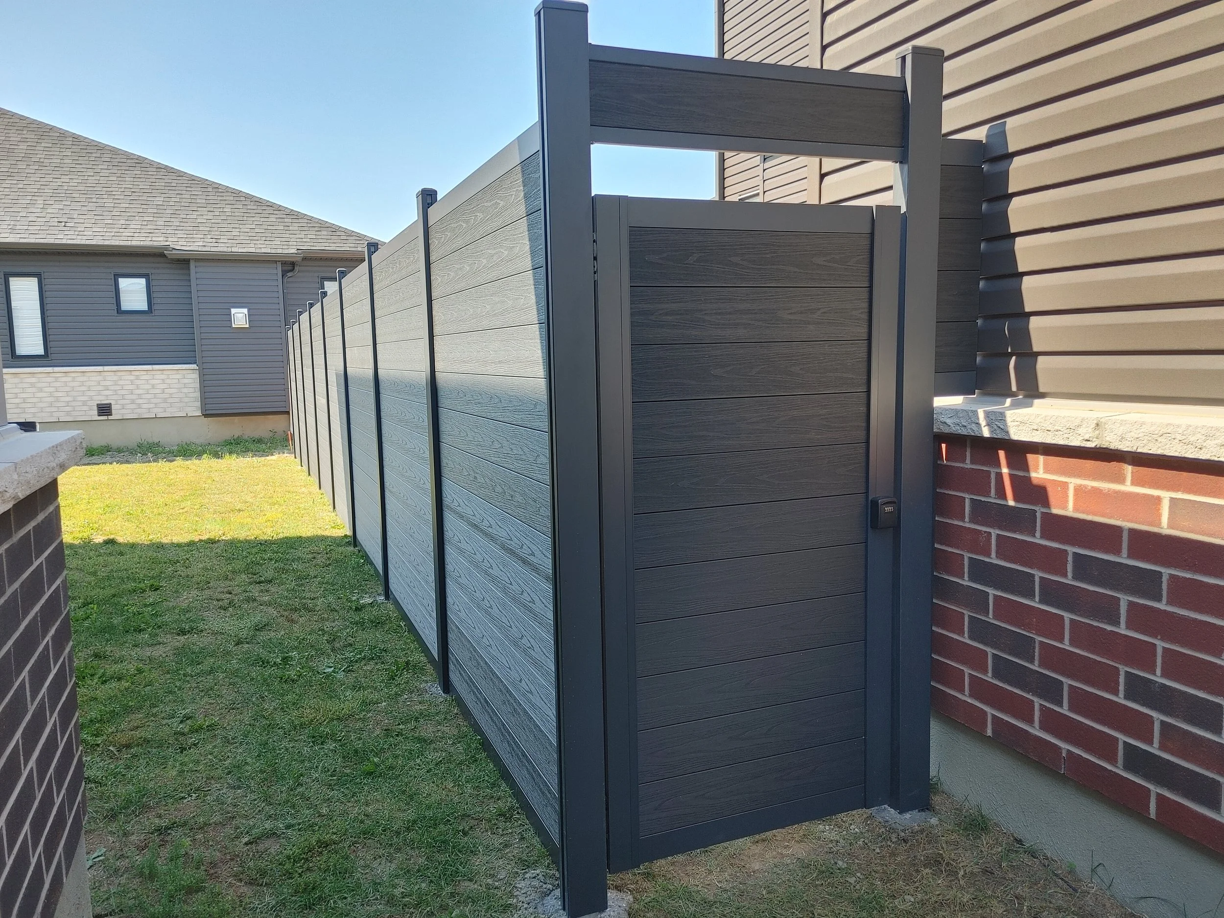 Black WPC Fence in Manotick, 2025. StandArt Fence 