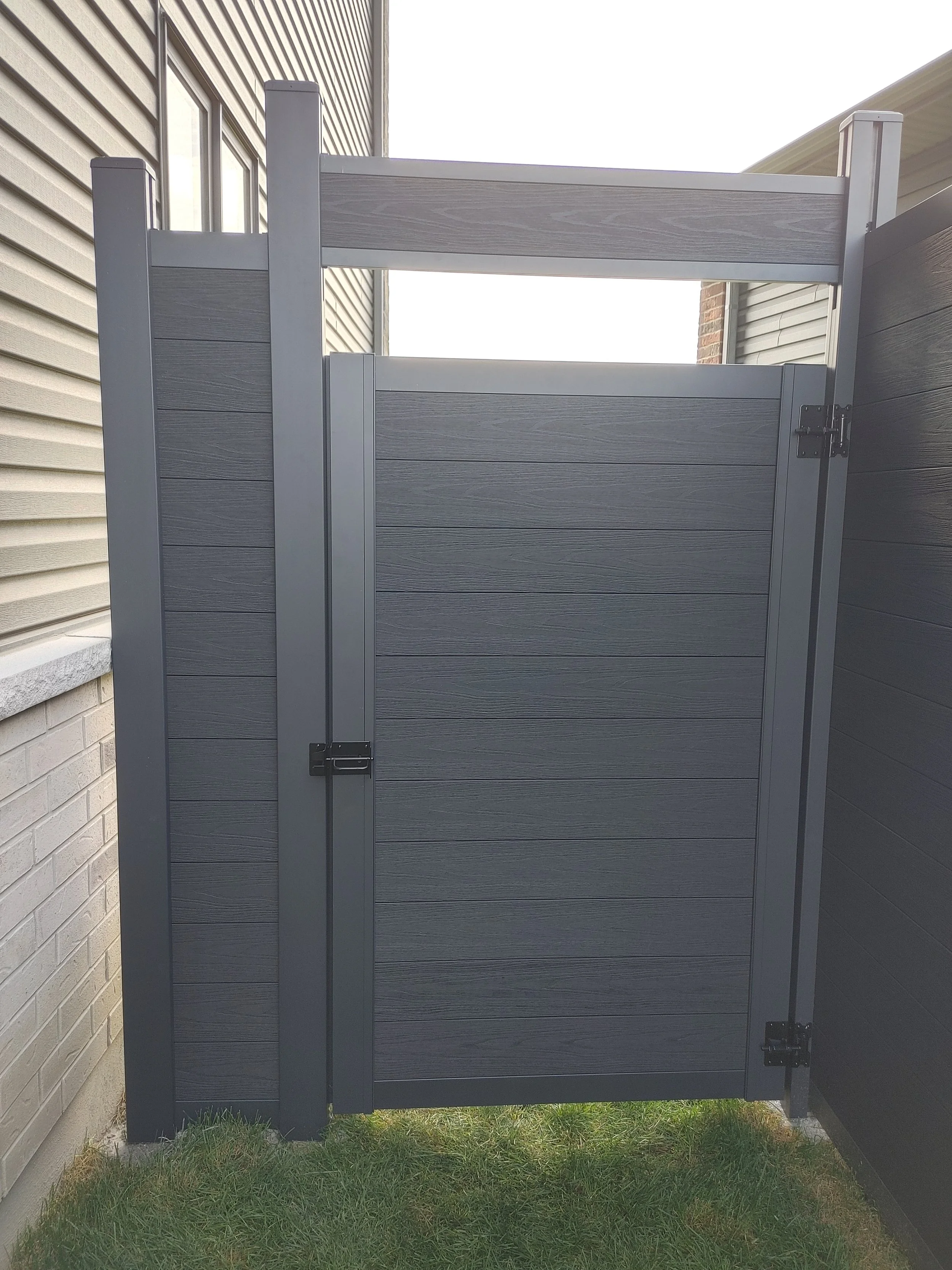 Black WPC Fence in Manotick, 2025. StandArt Fence