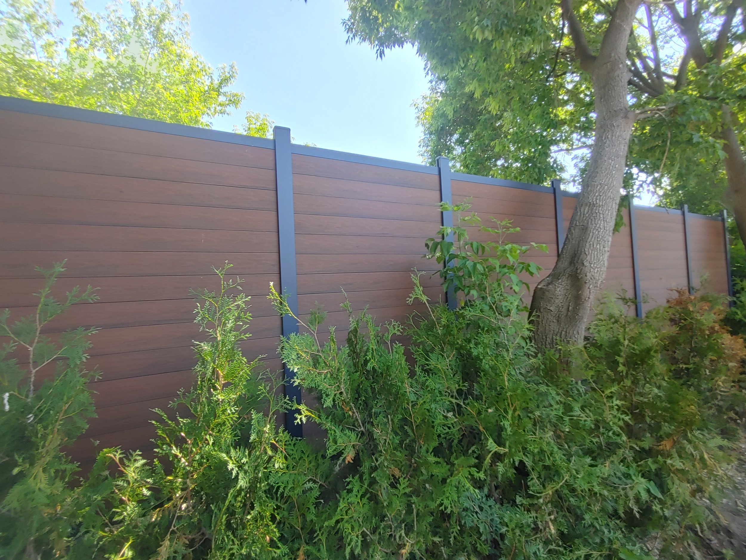 Brown WPC Fence in Vanier, 2025. StandArt Fence 