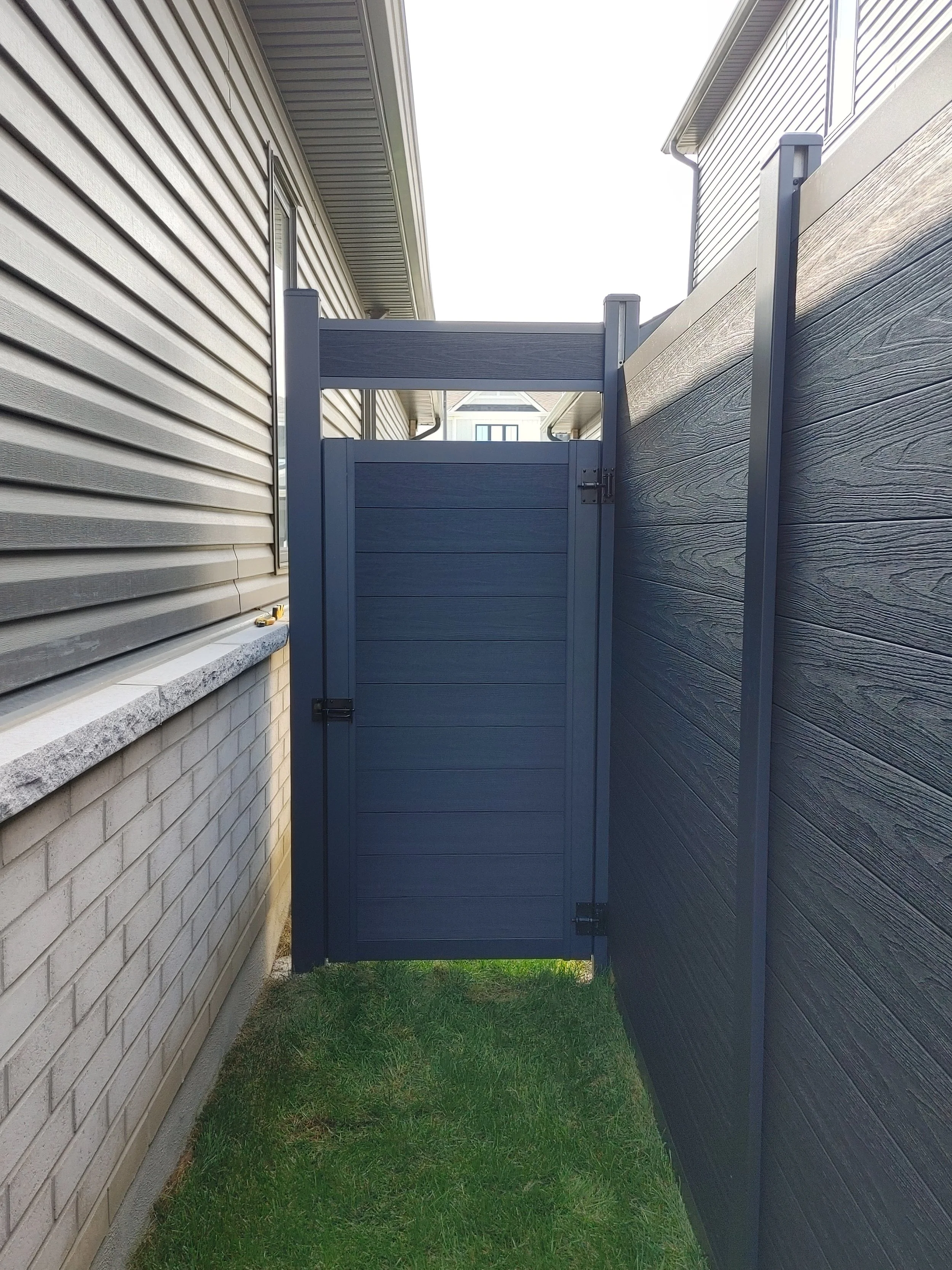 Black WPC Fence in Manotick, 2025. StandArt Fence