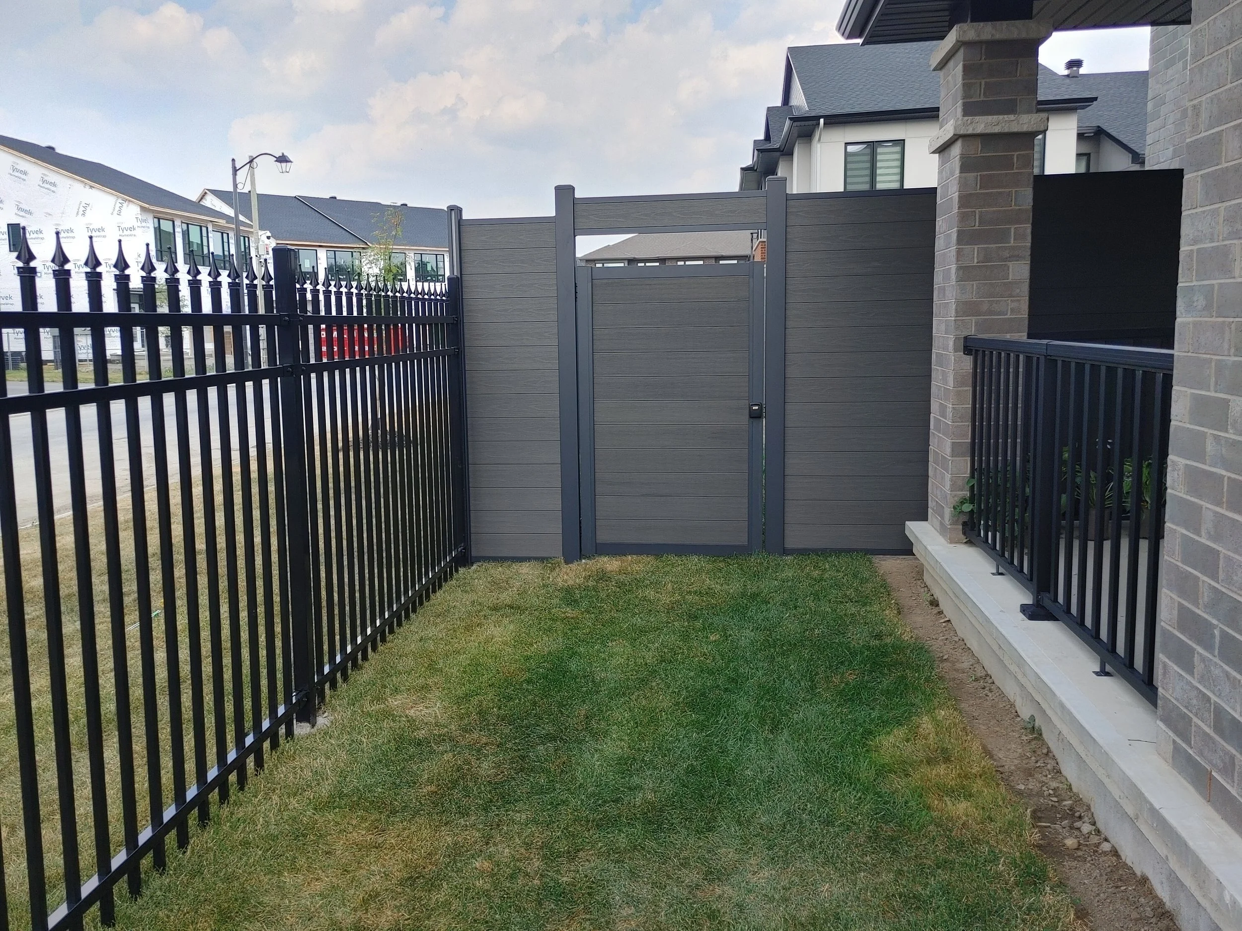 Dark Grey WPC/Iron Fence in Stittsville, 2025. StandArt Fence 