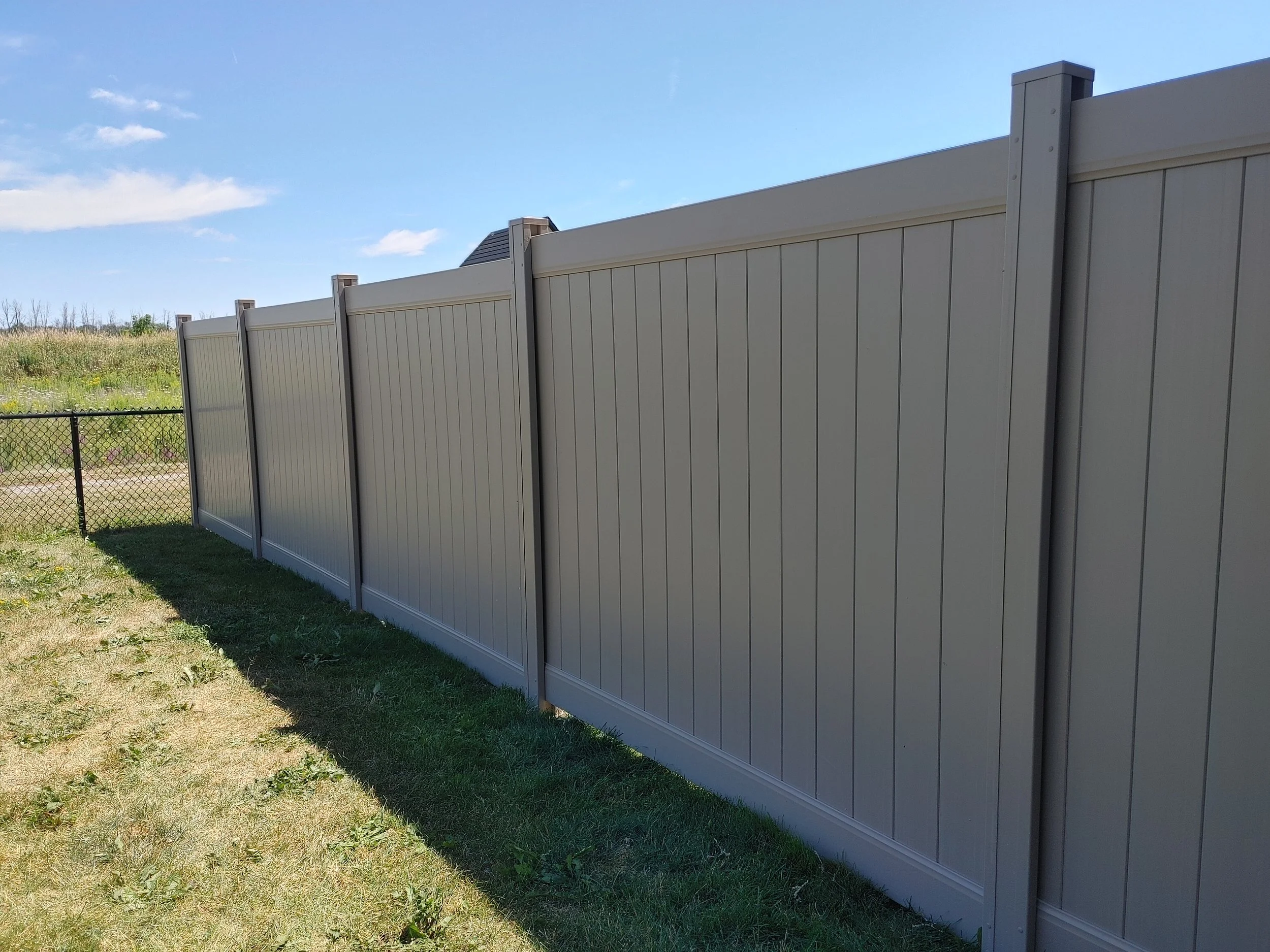 Adobe PVC Fence in Carleton Place, 2025. StandArt Fence 