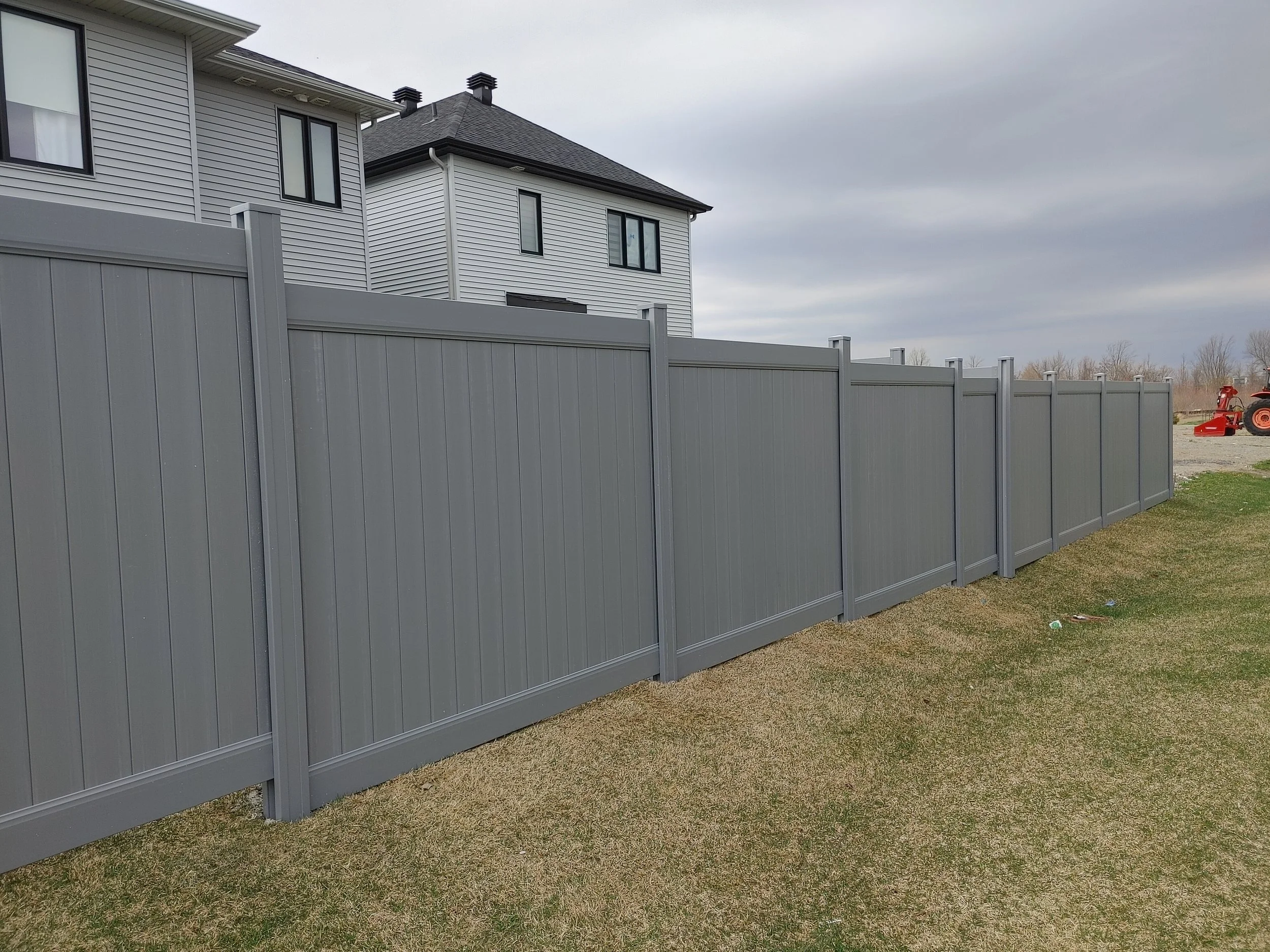 Grey PVC Fence in Barrhaven, 2025. StandArt Fence 
