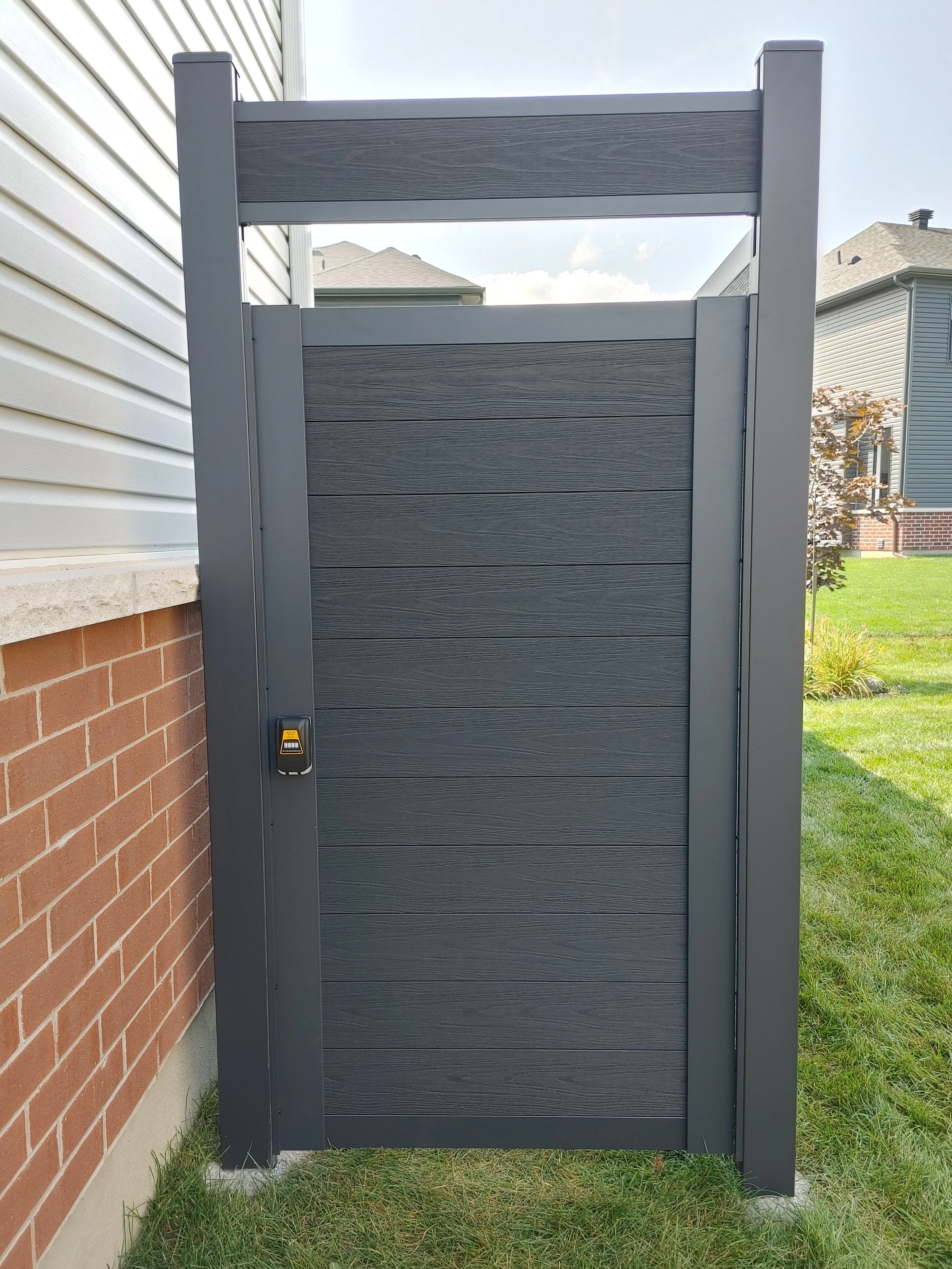 Black WPC Fence in Manotick, 2025. StandArt Fence