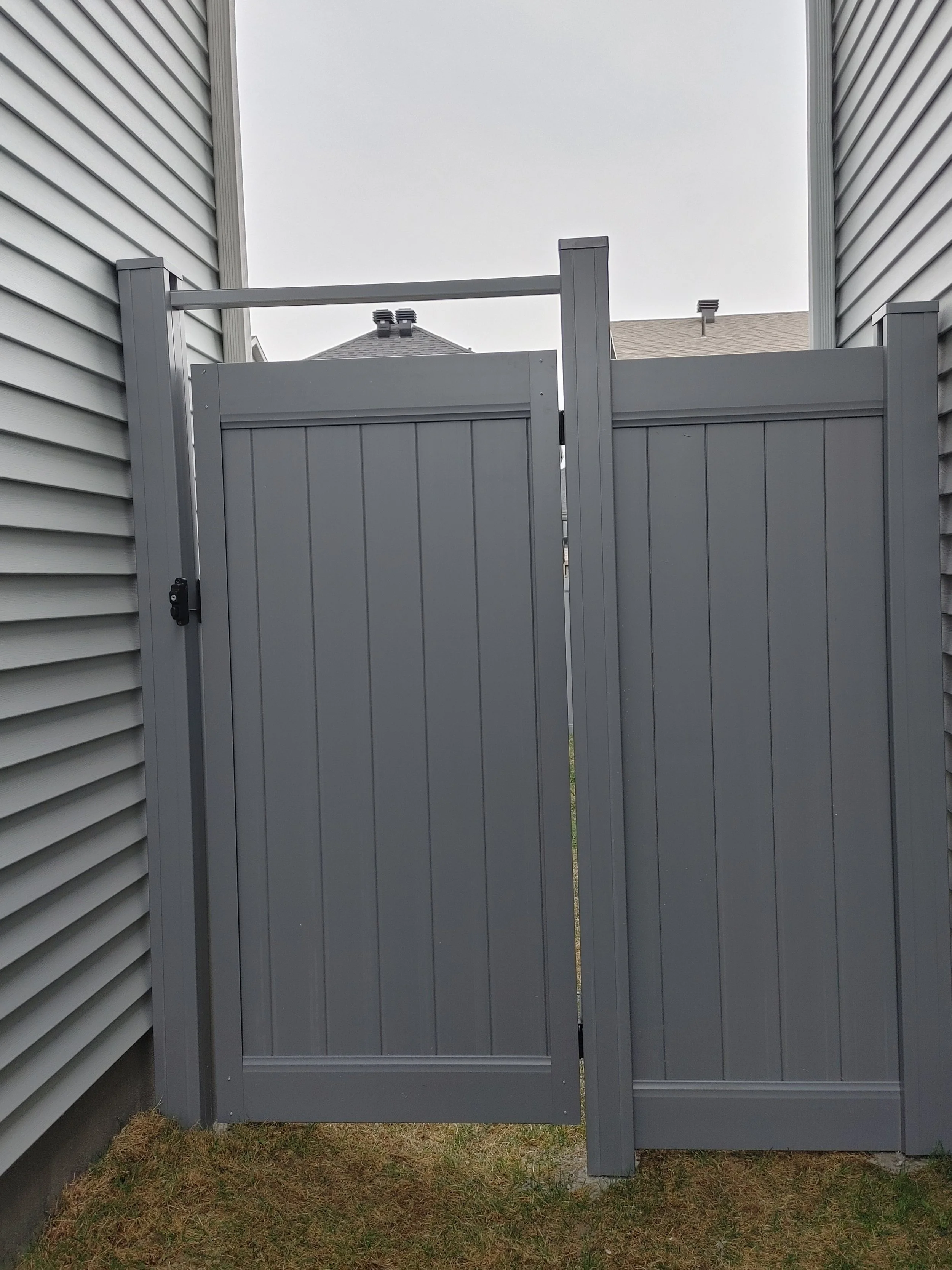 Grey PVC Fence in Barrhaven, 2025. StandArt Fence 