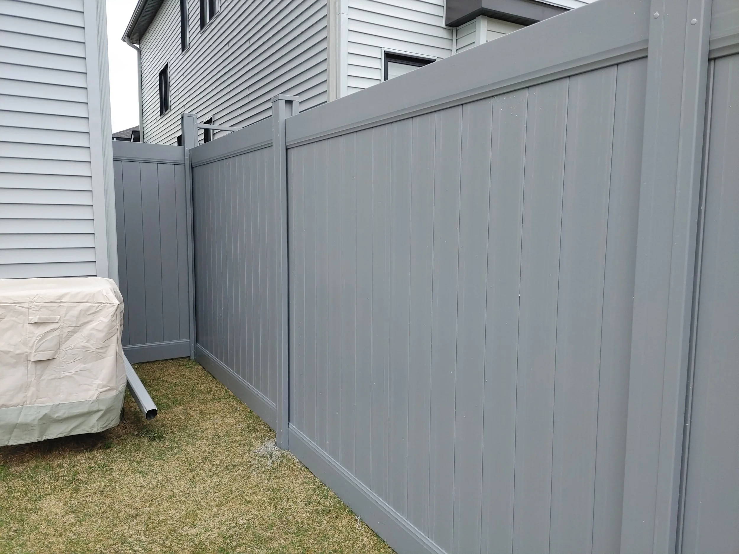 Grey PVC Fence in Barrhaven, 2025. StandArt Fence 