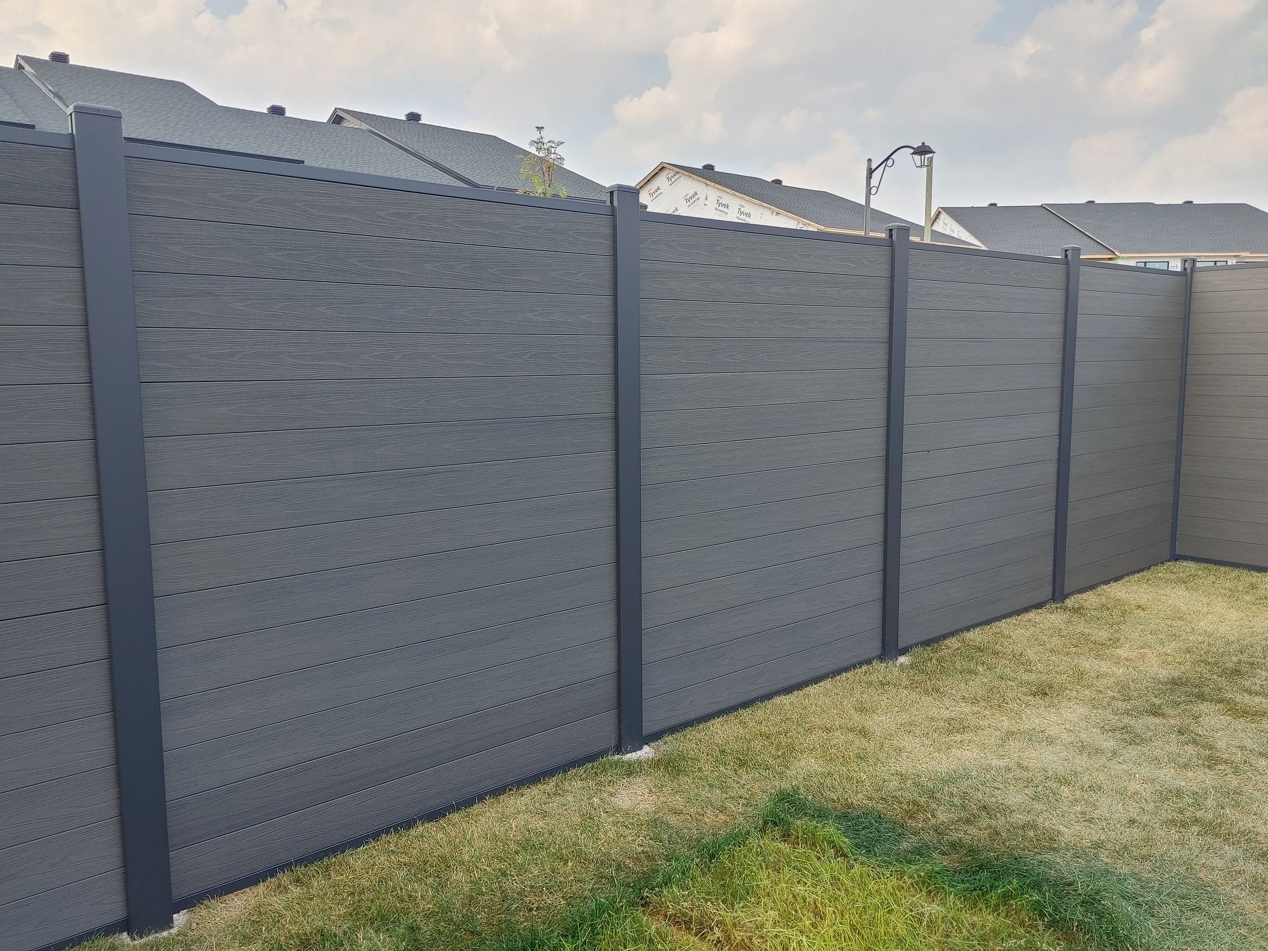 Dark Grey WPC/Iron Fence in Stittsville, 2025. StandArt Fence 