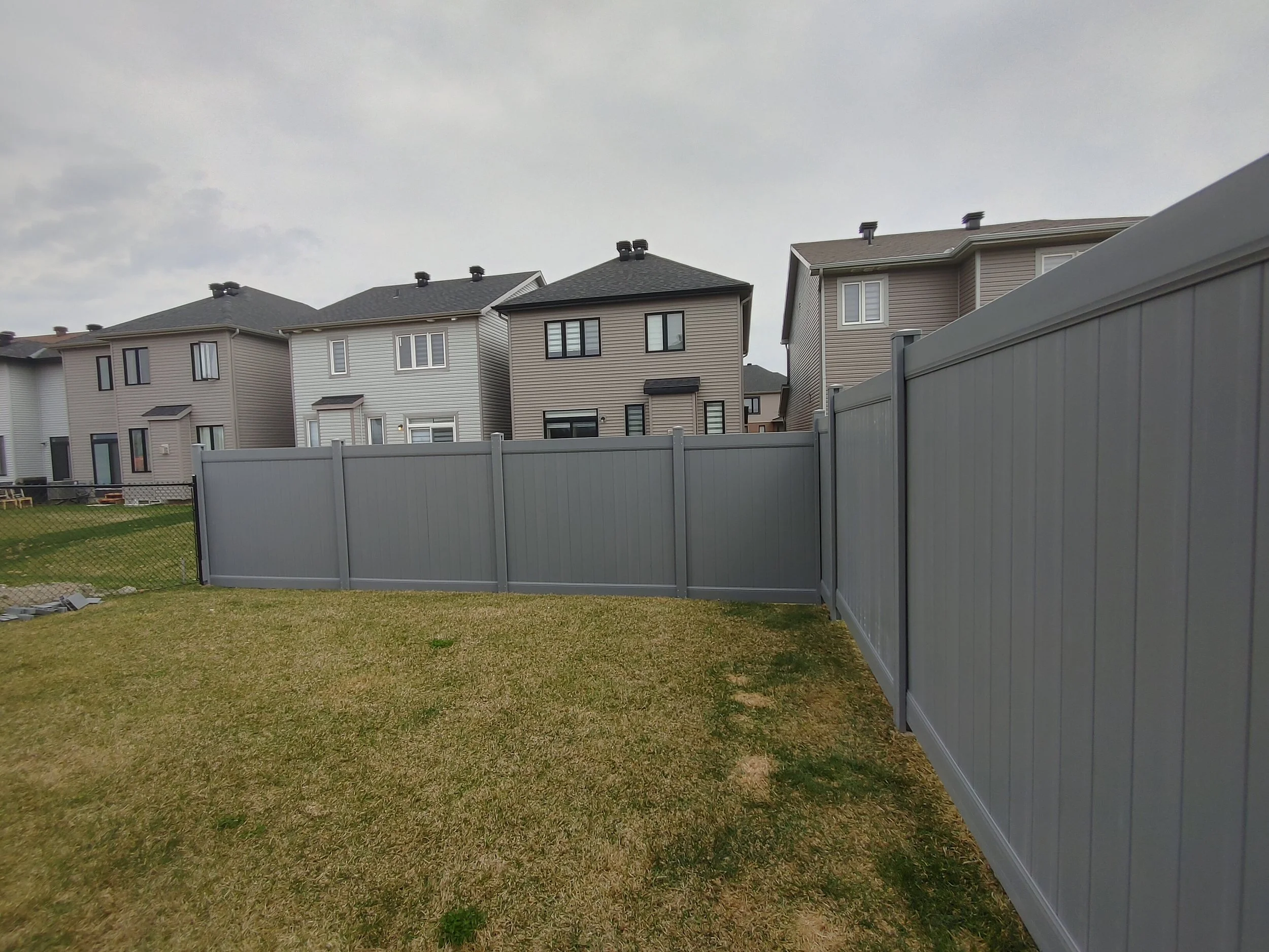 Grey PVC Fence in Barrhaven, 2025. StandArt Fence 