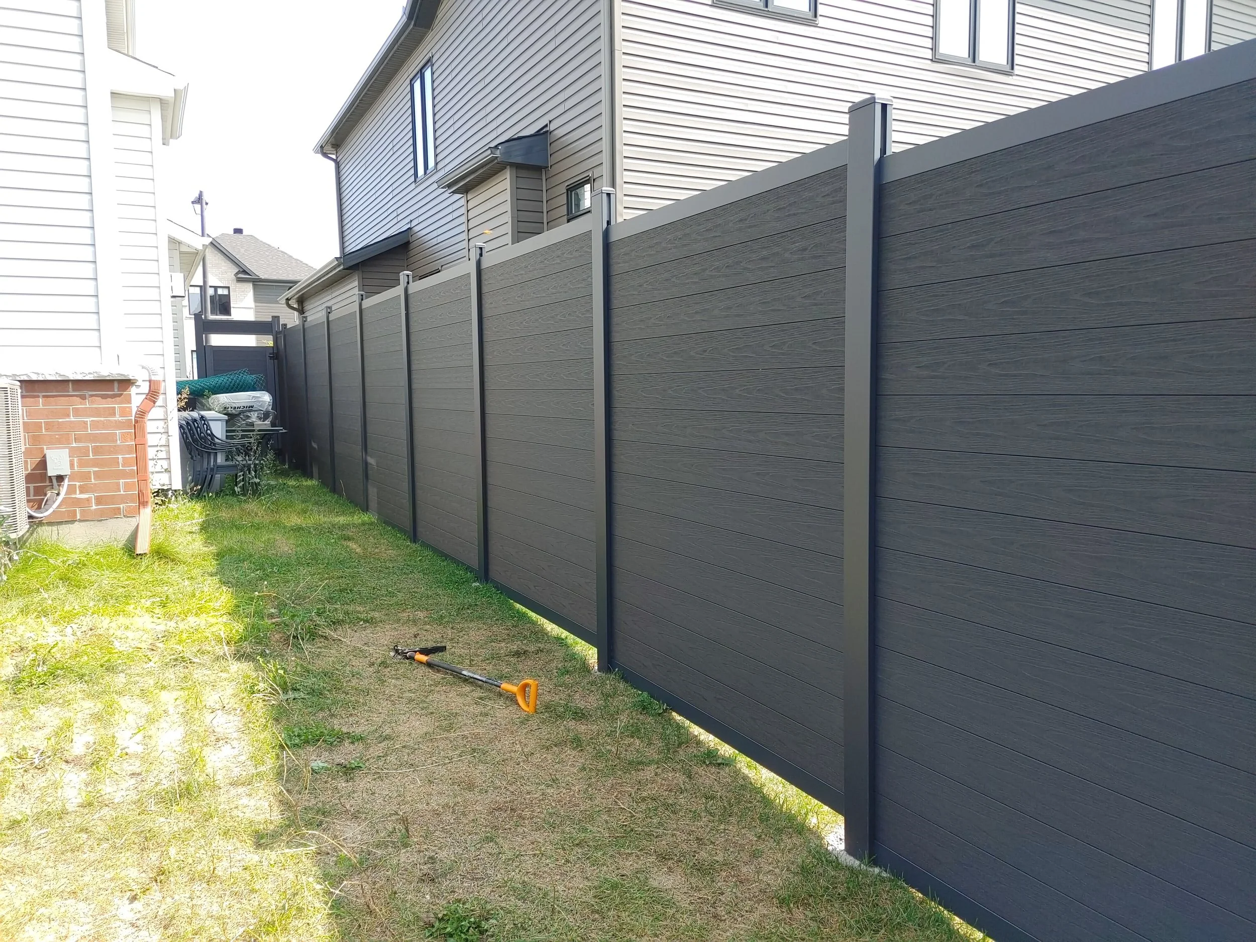 Black WPC Fence in Manotick, 2025. StandArt Fence