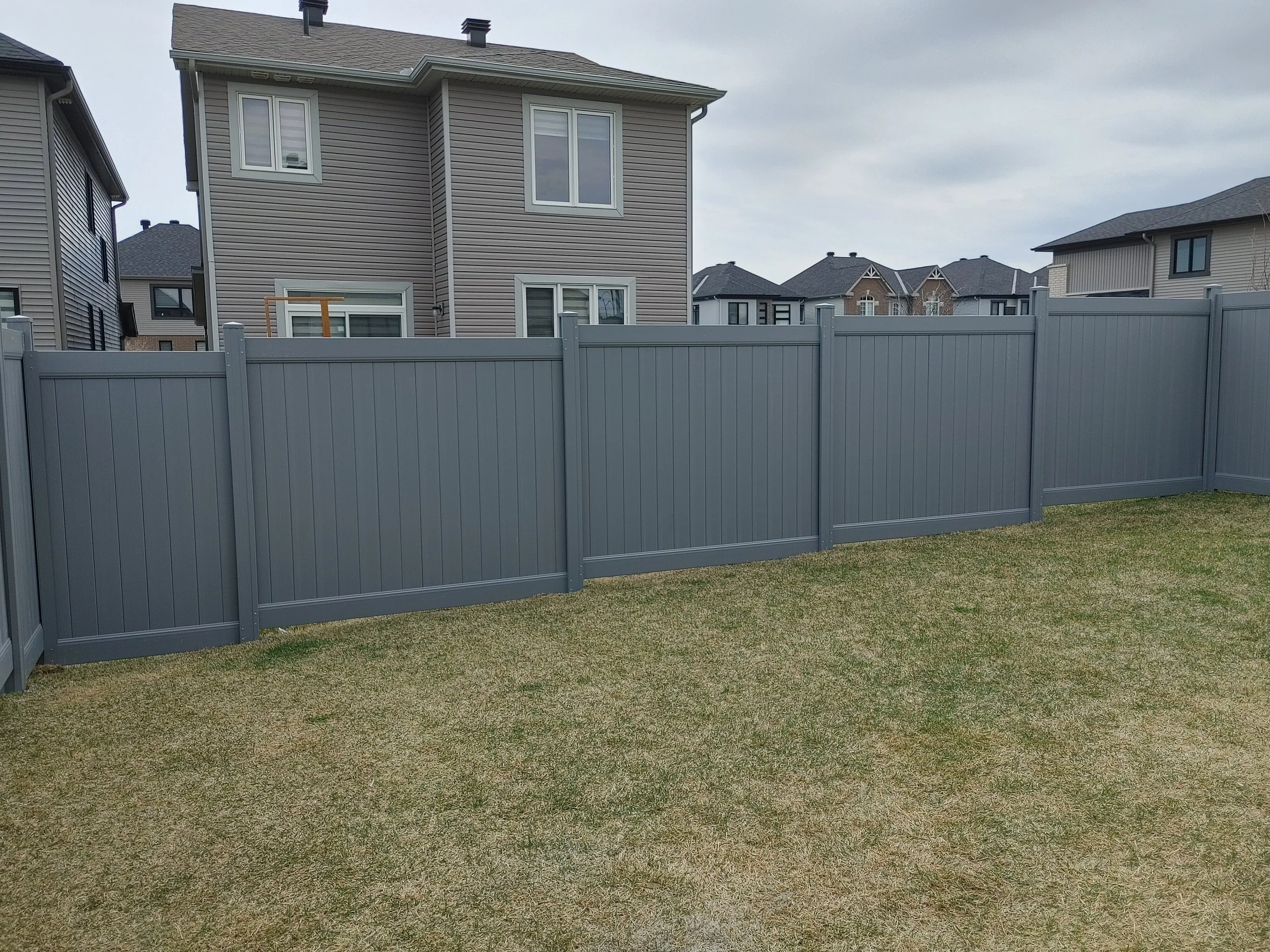 Grey PVC Fence in Barrhaven, 2025. StandArt Fence 