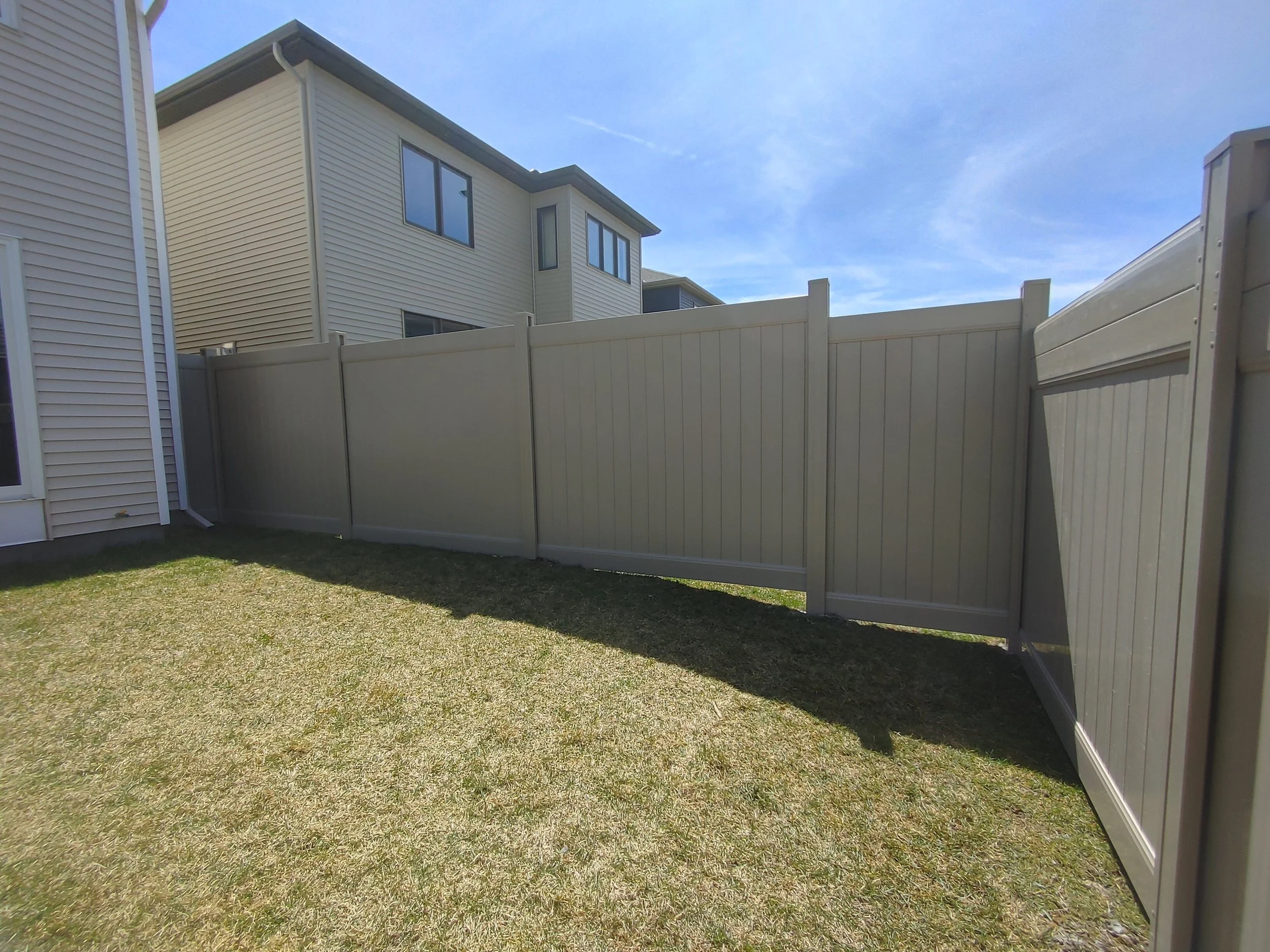 Grey PVC Fence in Barrhaven, 2025. StandArt Fence 