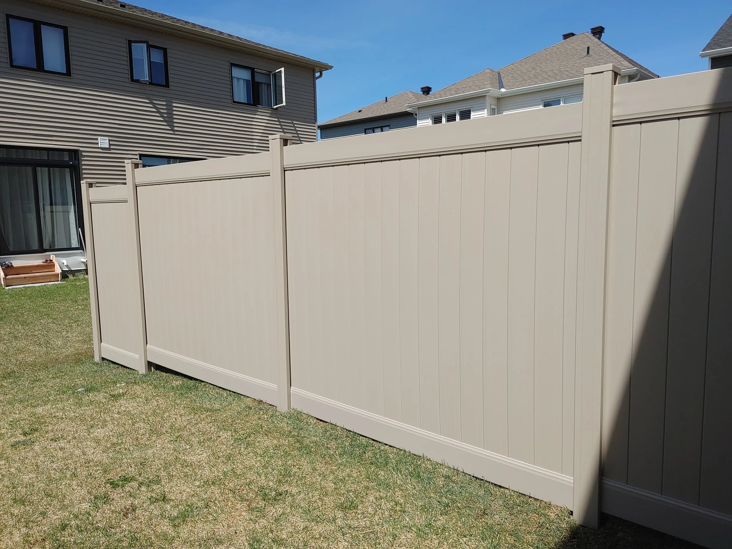 Grey PVC Fence in Barrhaven, 2025. StandArt Fence 