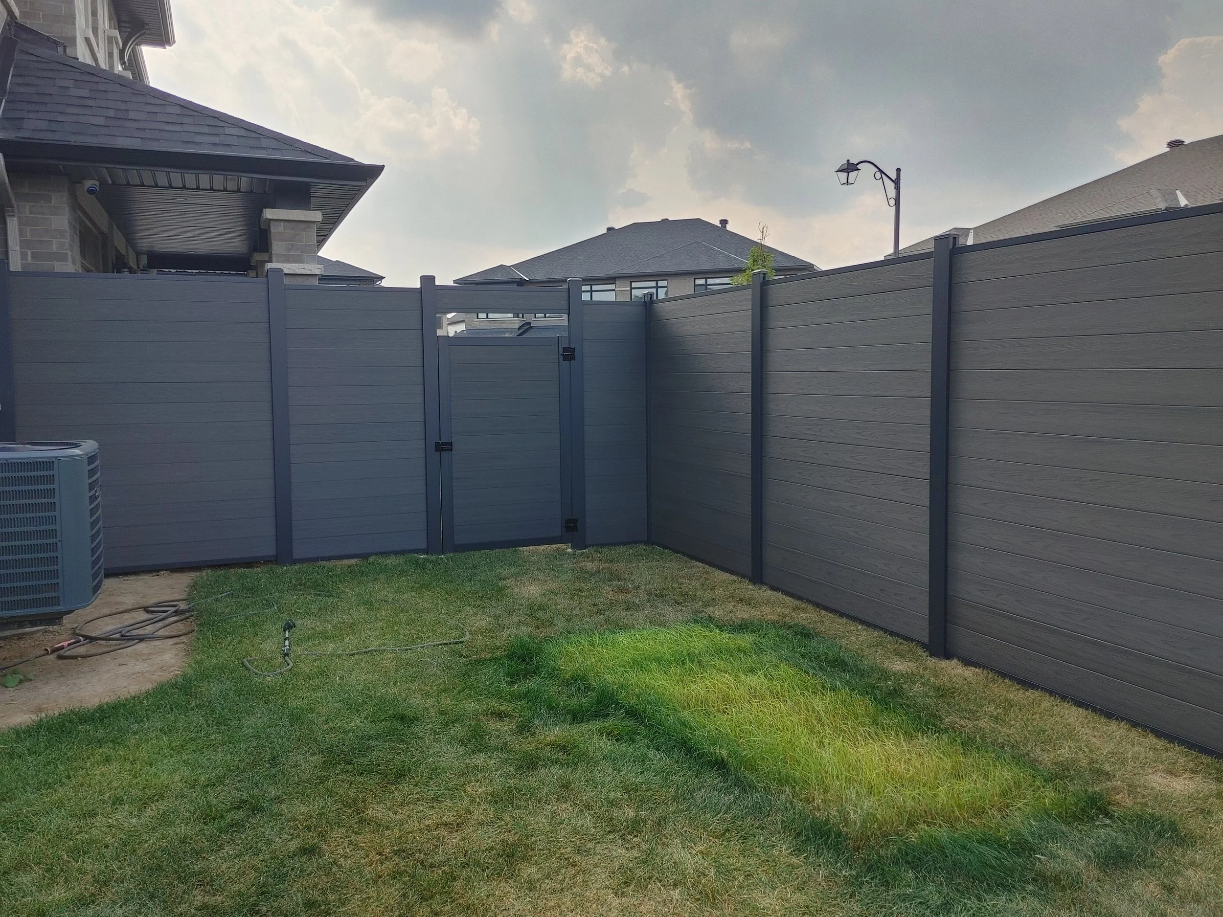 Dark Grey WPC/Iron Fence in Stittsville, 2025. StandArt Fence 
