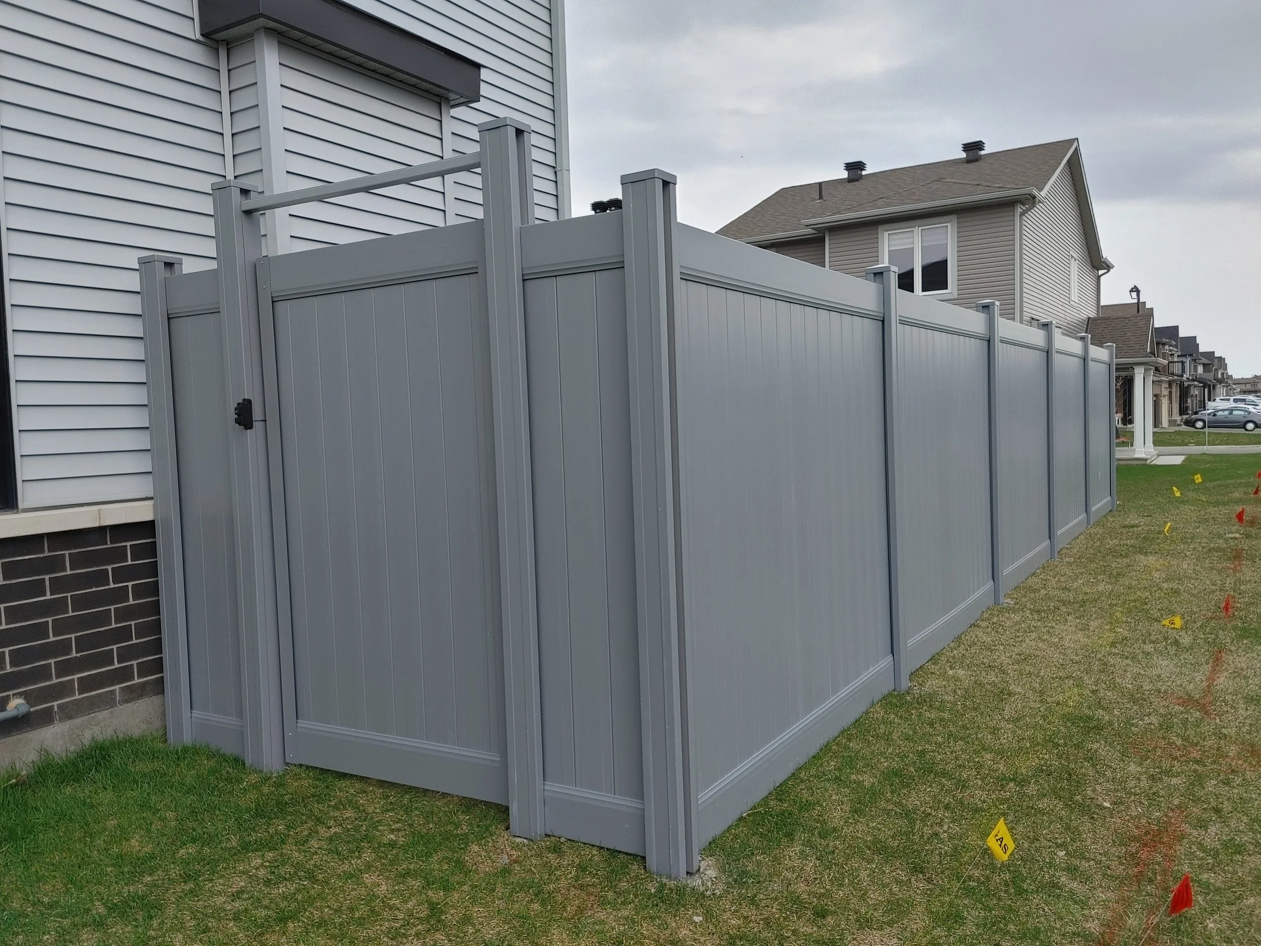 Grey PVC Fence in Barrhaven, 2025. StandArt Fence 