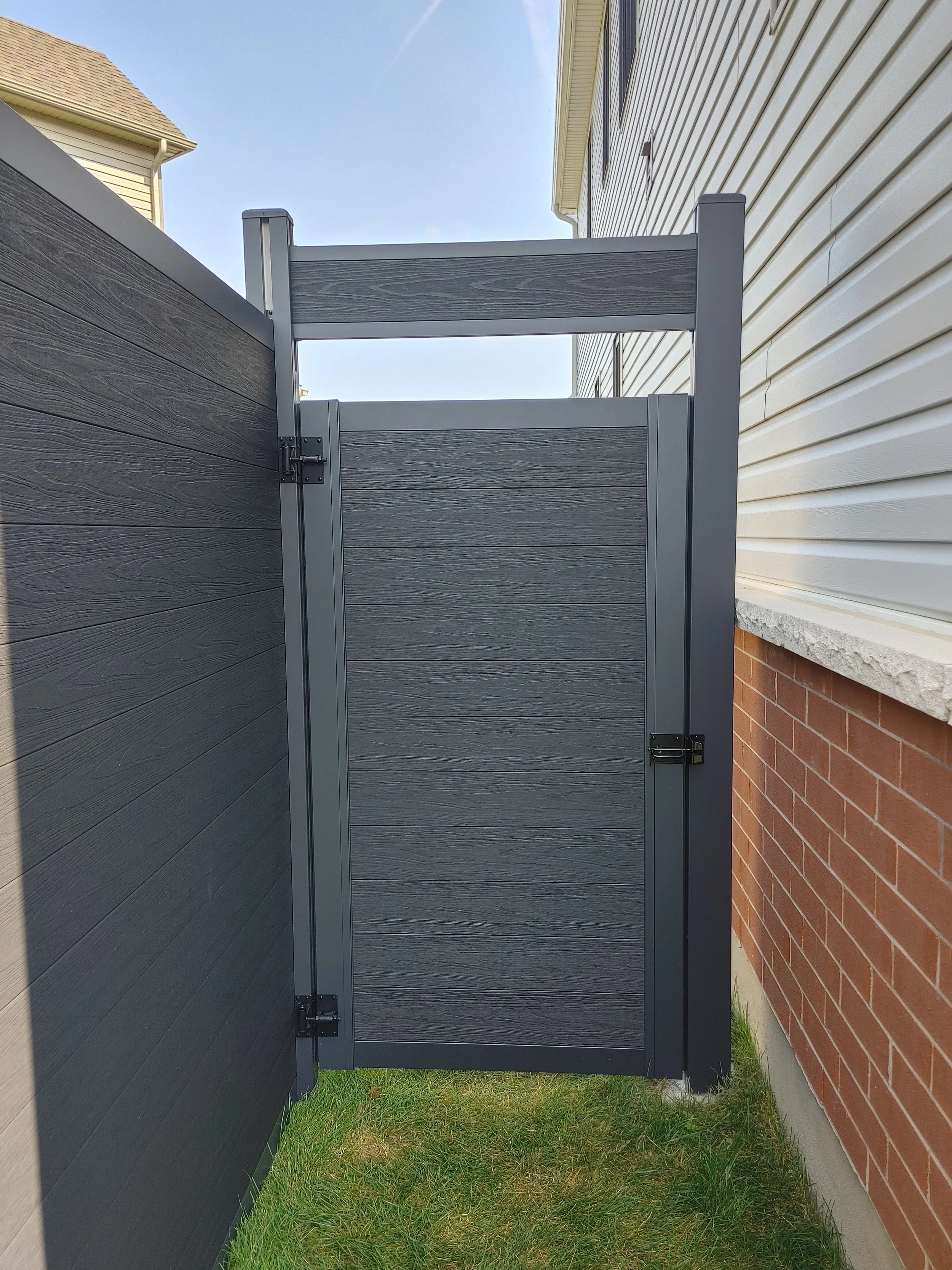 Black WPC Fence in Manotick, 2025. StandArt Fence