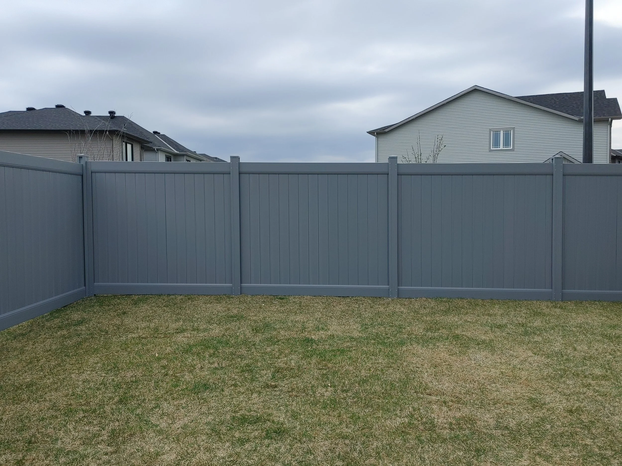 Grey PVC Fence in Barrhaven, 2025. StandArt Fence 