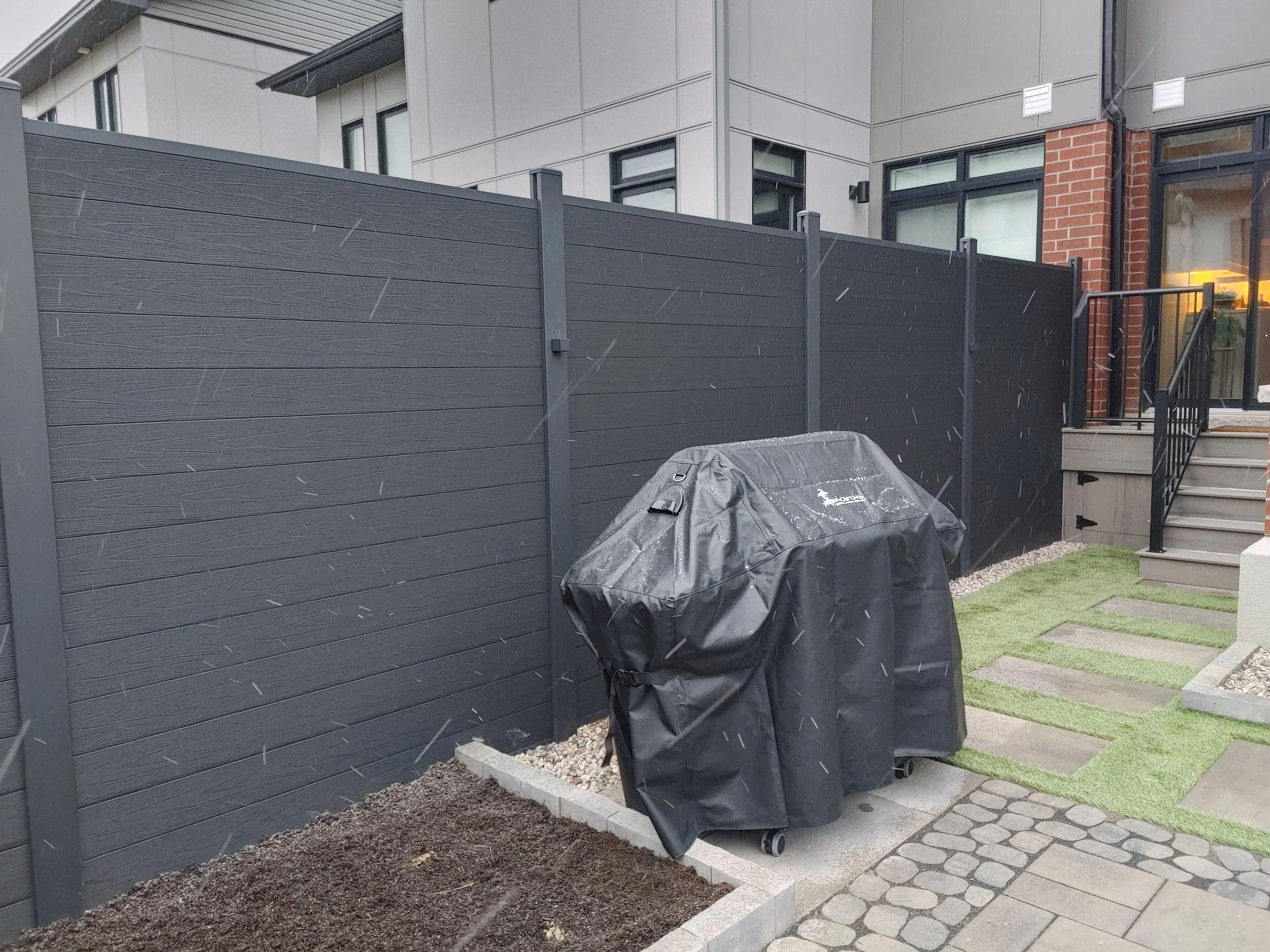 Black WPC Fence in Stittsville, 2025. StandArt Fence