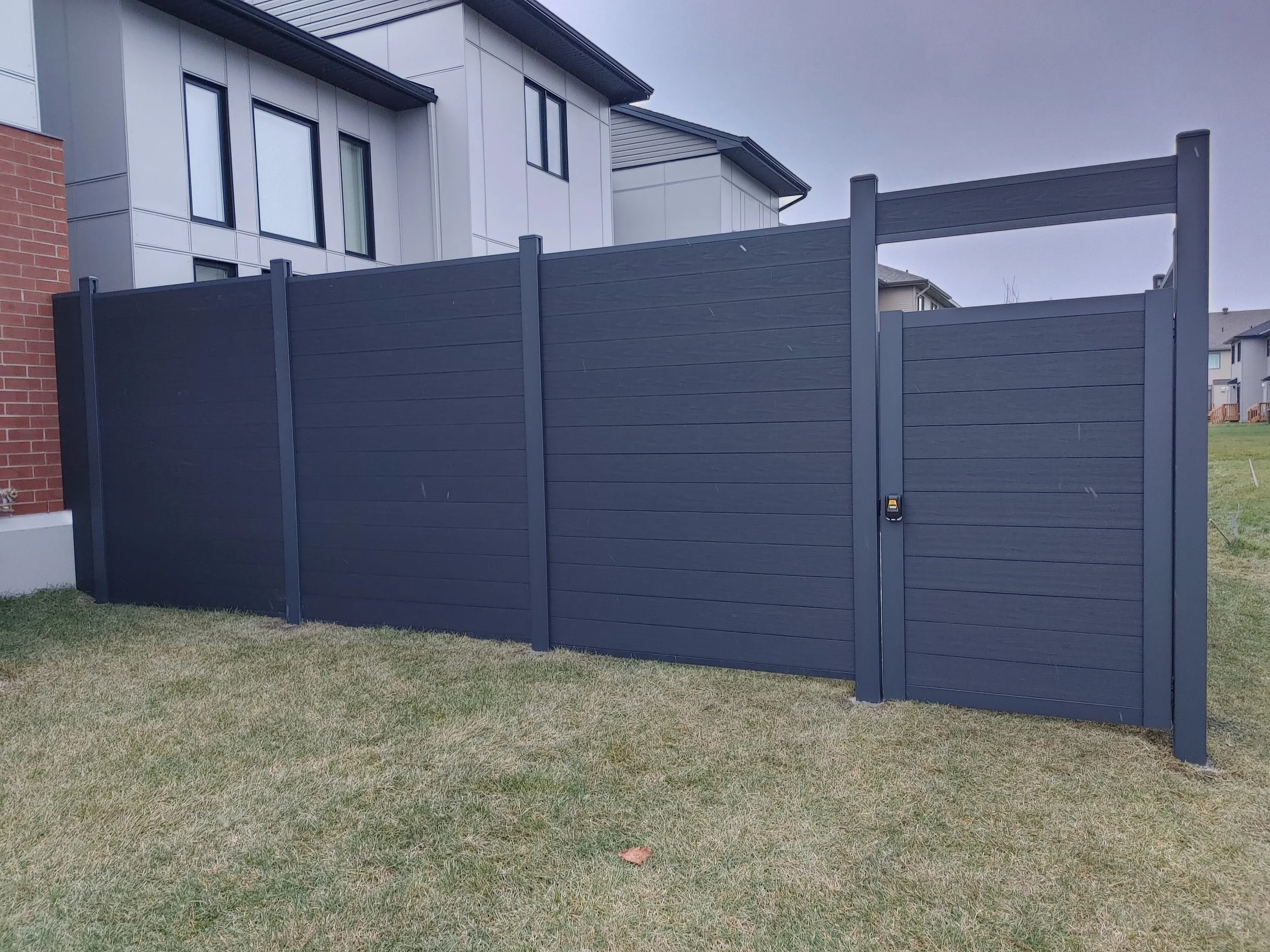 Black WPC Fence in Stittsville, 2025. StandArt Fence