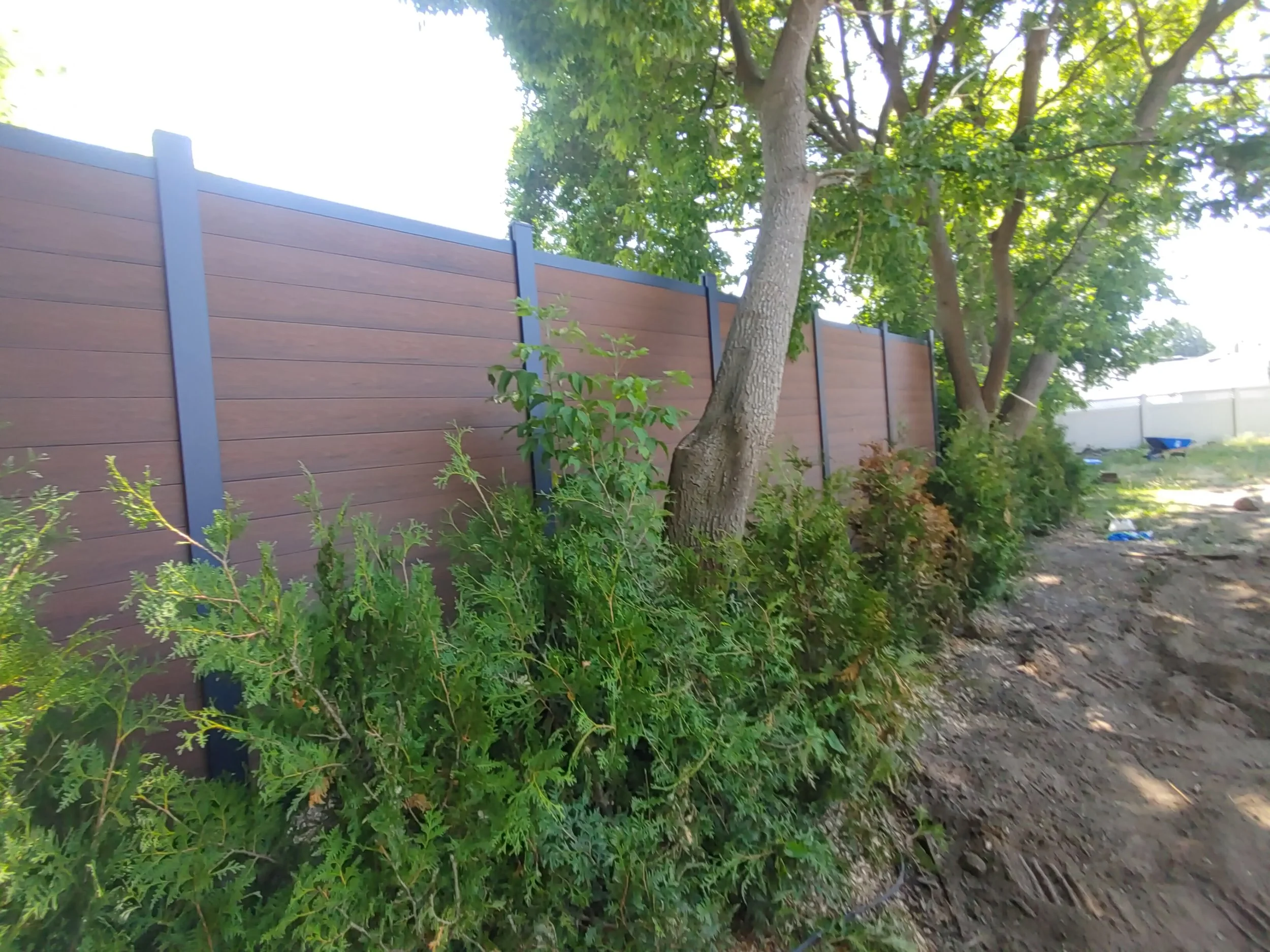 Brown WPC Fence in Vanier, 2025. StandArt Fence 