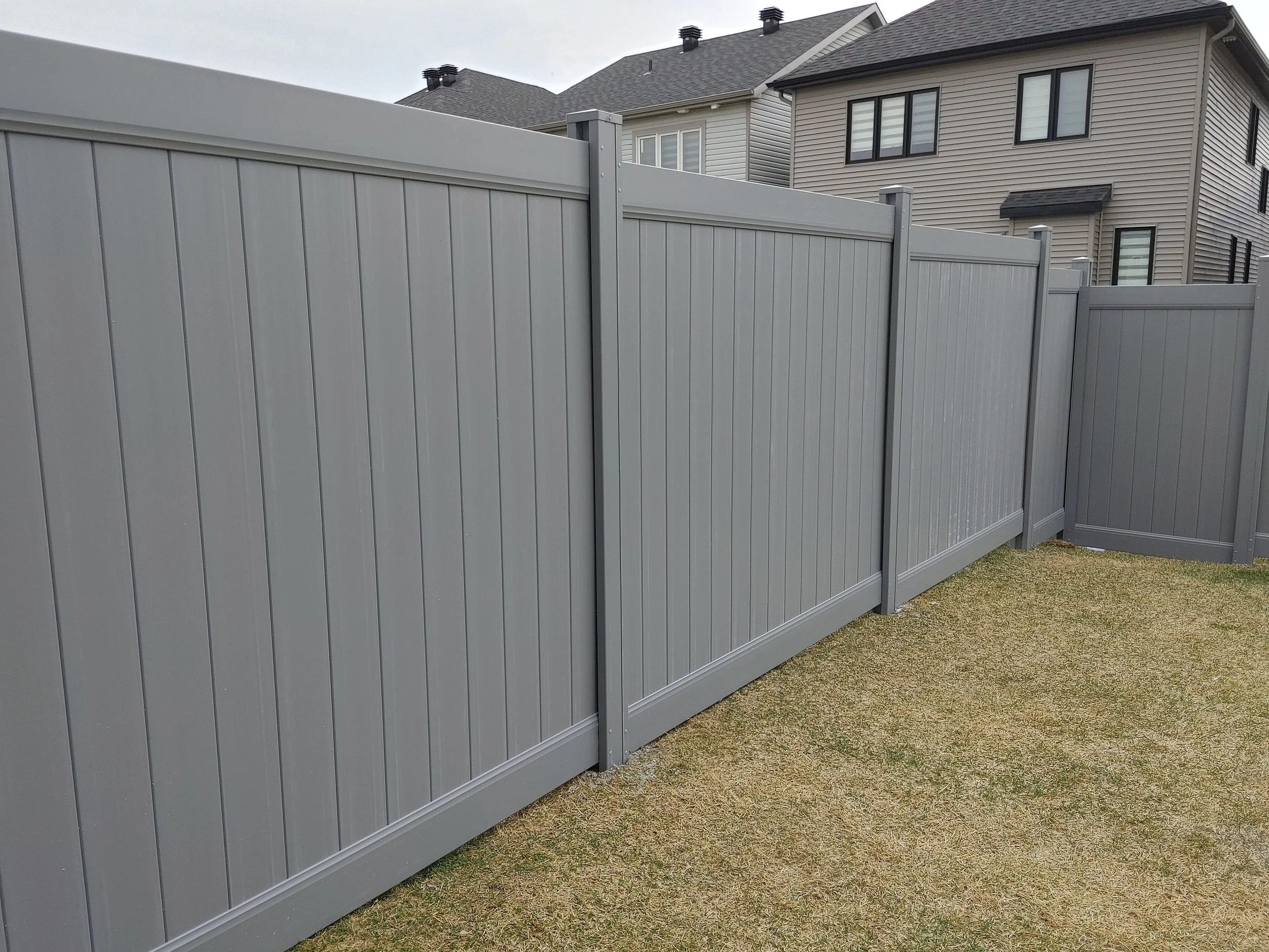 Grey PVC Fence in Barrhaven, 2025. StandArt Fence 