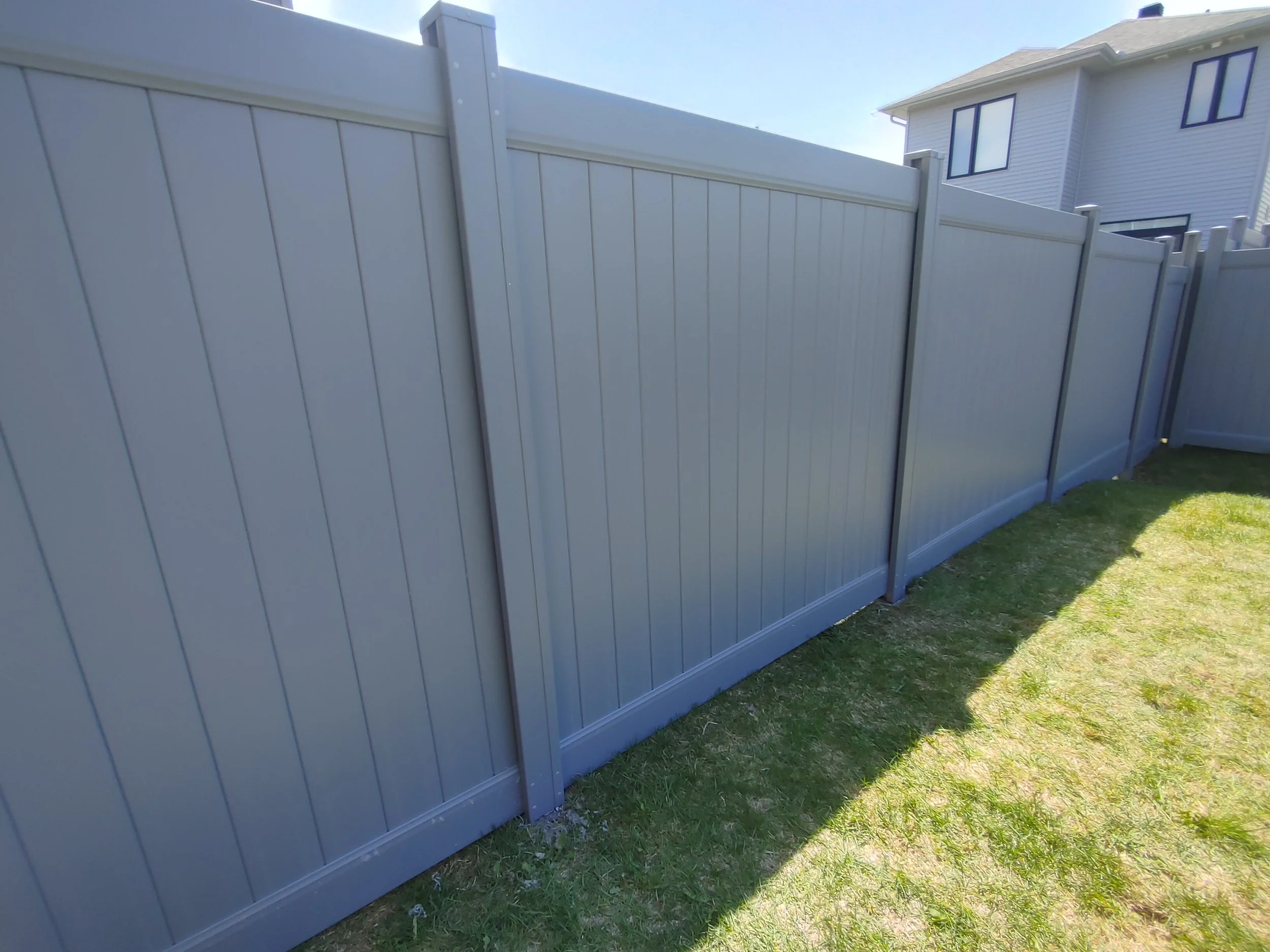 Grey PVC Fence in Barrhaven, 2025. StandArt Fence 