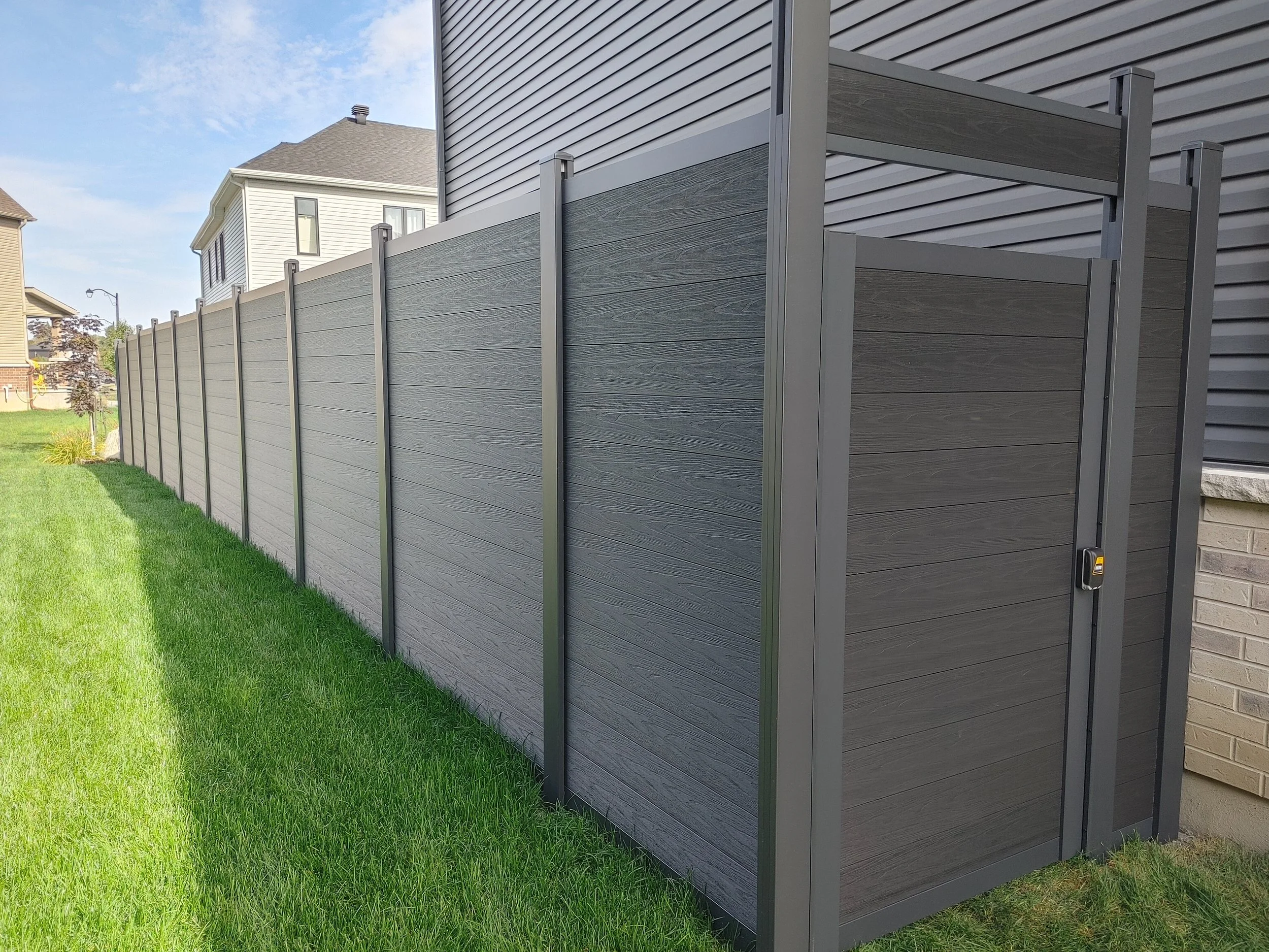 Black WPC Fence in Manotick, 2025. StandArt Fence