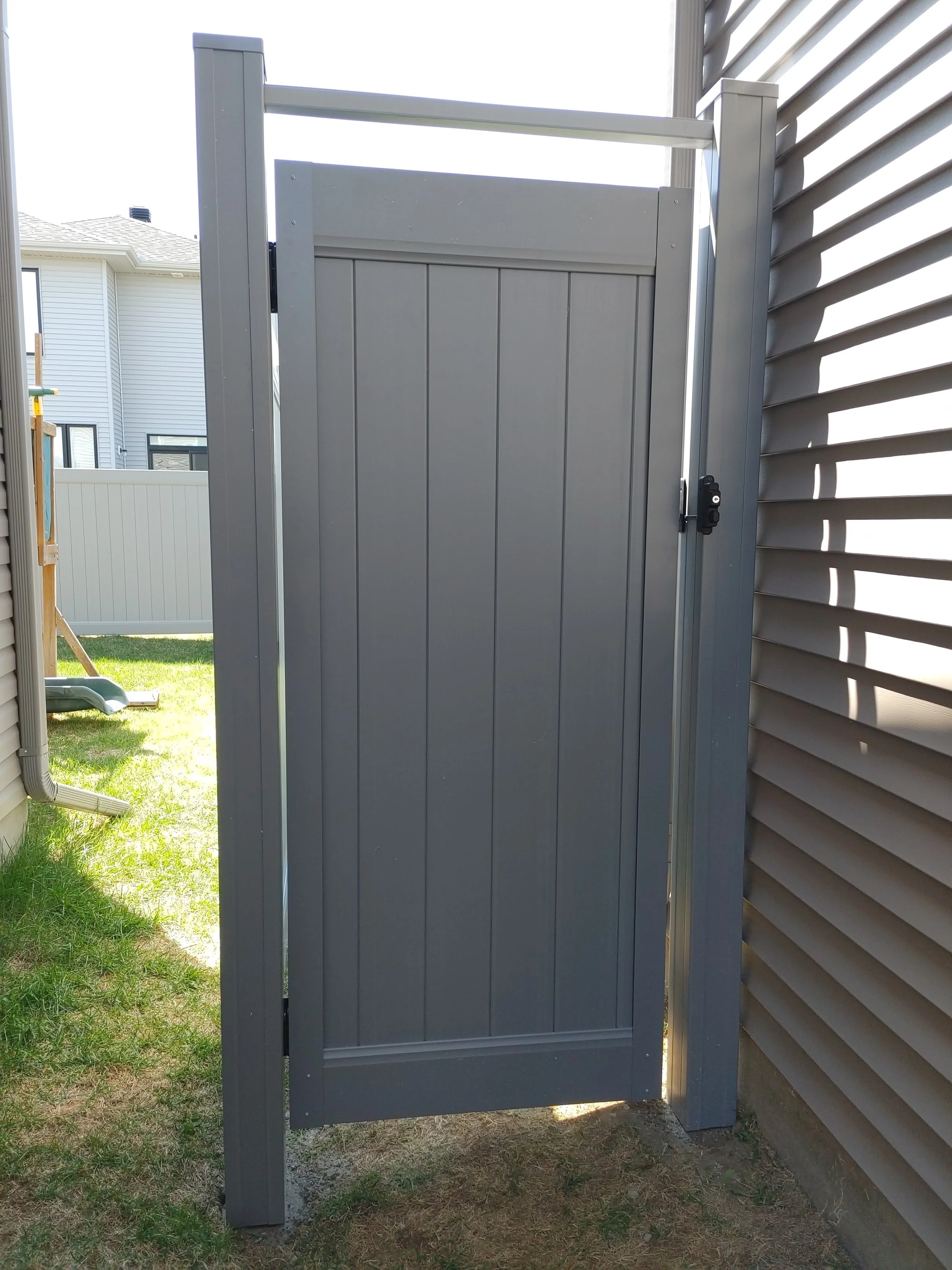 Grey PVC Fence in Barrhaven, 2025. StandArt Fence 