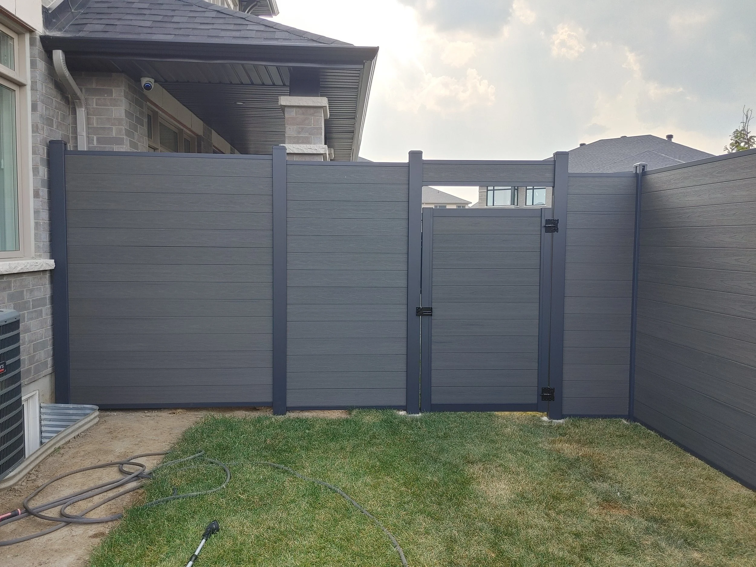Dark Grey WPC/Iron Fence in Stittsville, 2025. StandArt Fence 