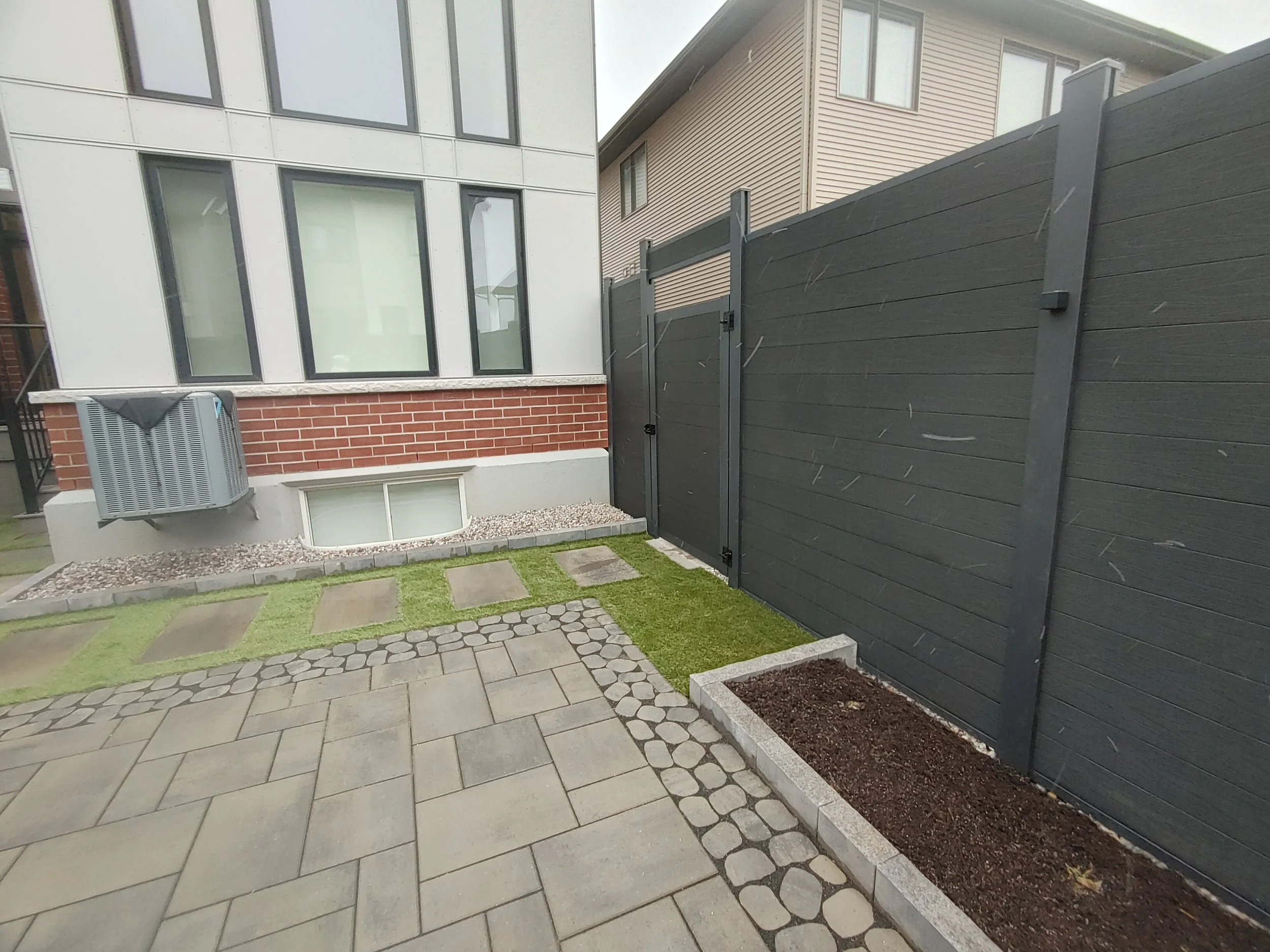 Black WPC Fence in Stittsville, 2025. StandArt Fence