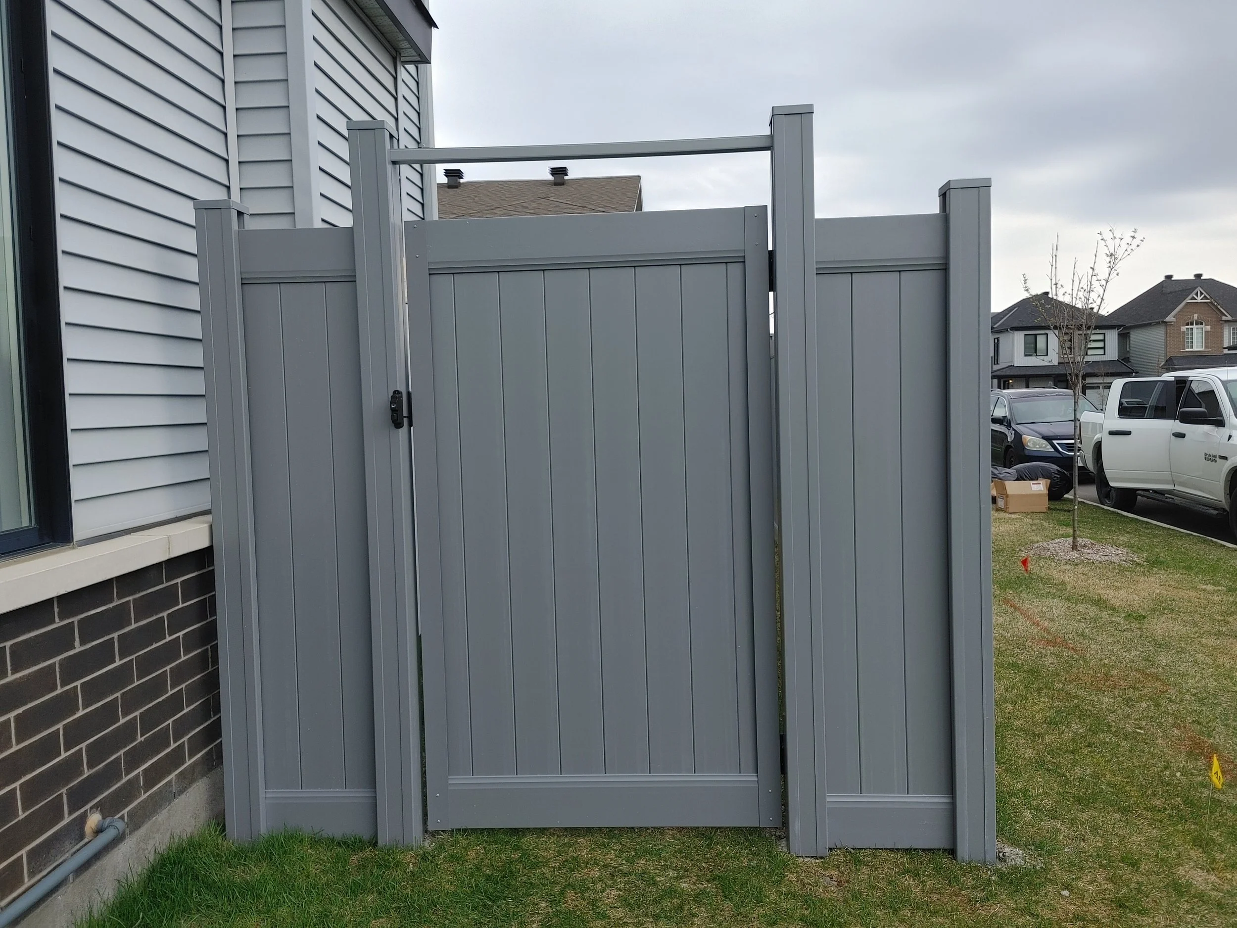 Grey PVC Fence in Barrhaven, 2025. StandArt Fence 