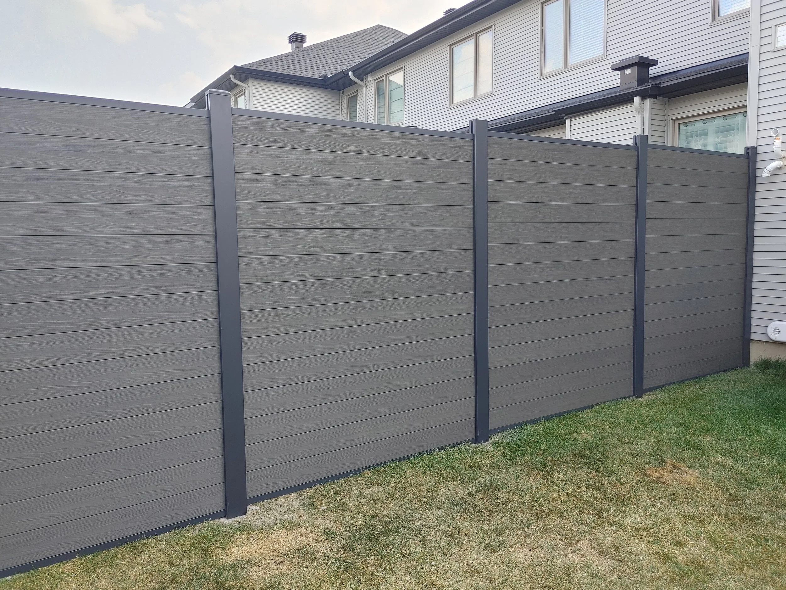 Dark Grey WPC/Iron Fence in Stittsville, 2025. StandArt Fence 