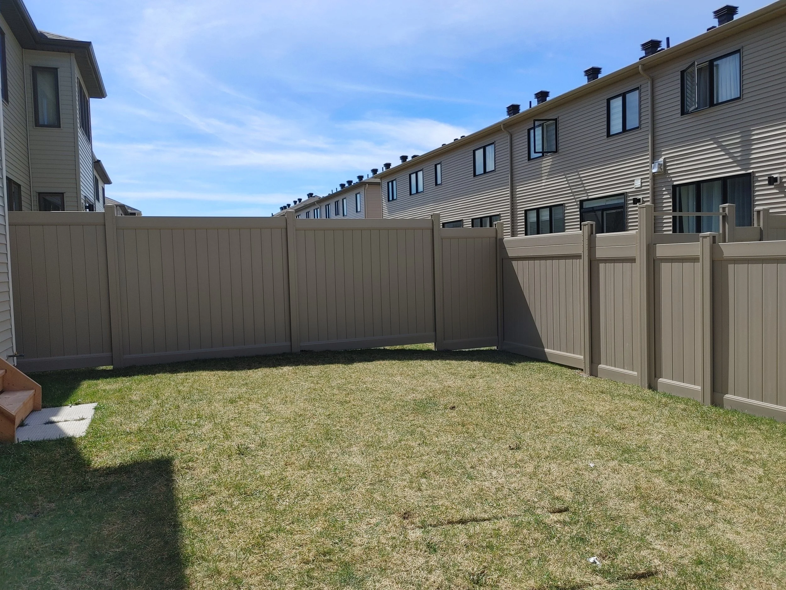 Grey PVC Fence in Barrhaven, 2025. StandArt Fence 