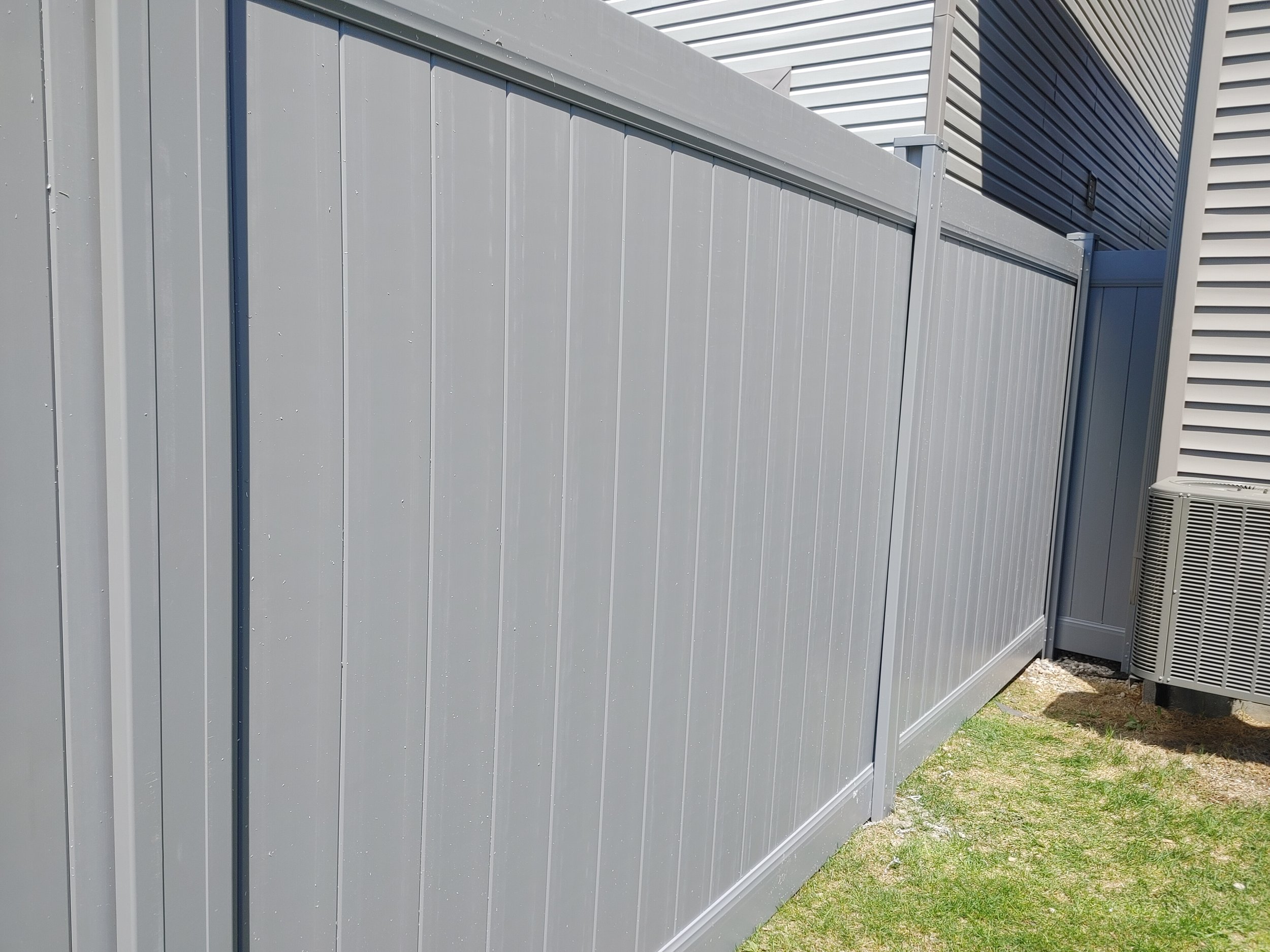 Grey PVC Fence in Barrhaven, 2025. StandArt Fence 