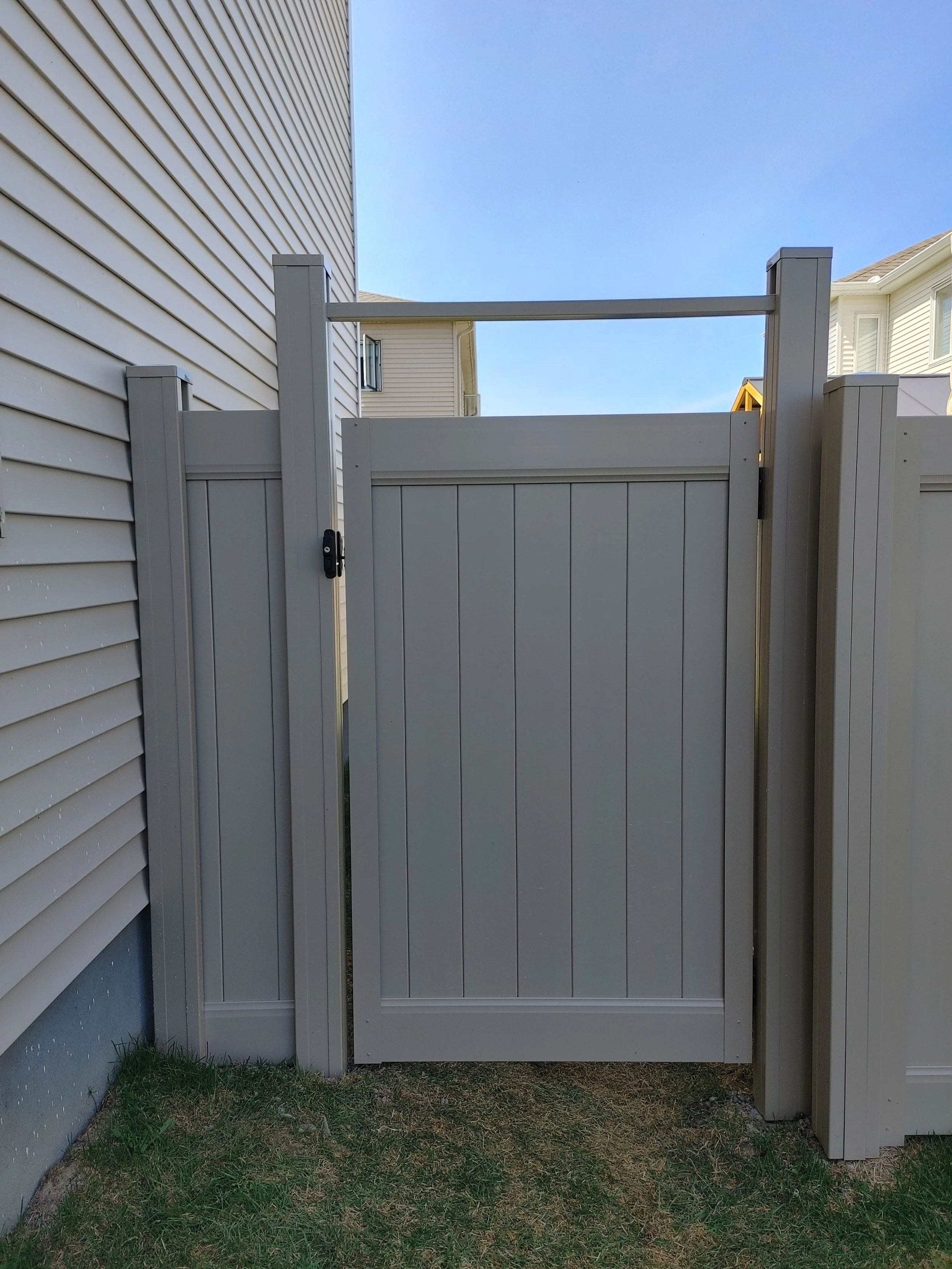 Grey PVC Fence in Barrhaven, 2025. StandArt Fence 